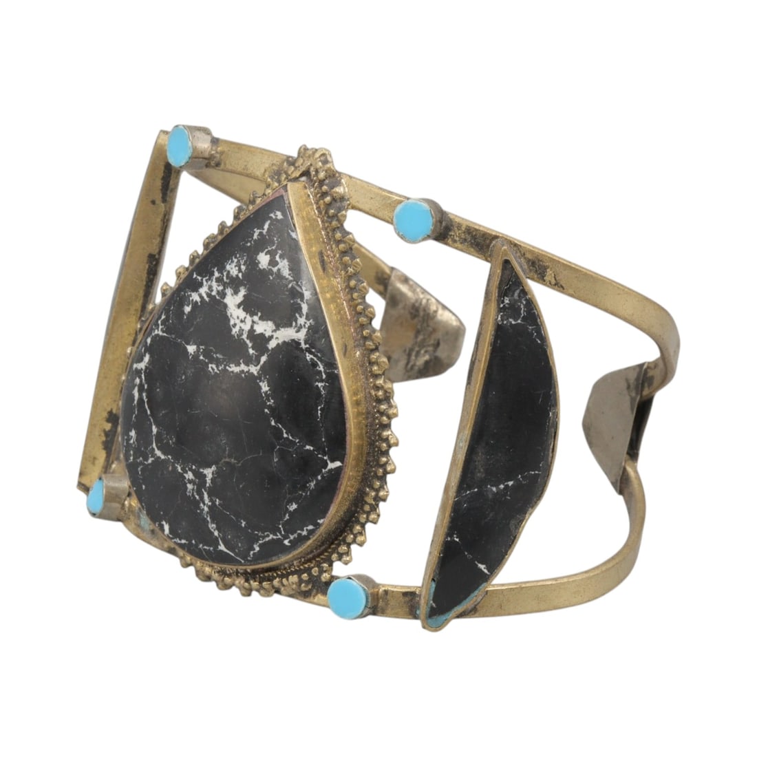A Vintage Himalayan Stone Inlay Cuff Bracelet, 30AH: A handcrafted vintage cuff bracelet, measuring approximately 7 cm in width, featuring traditional Himalayan jewelry design. The piece has a brass-toned metal base, showcasing a large teardrop-shaped b