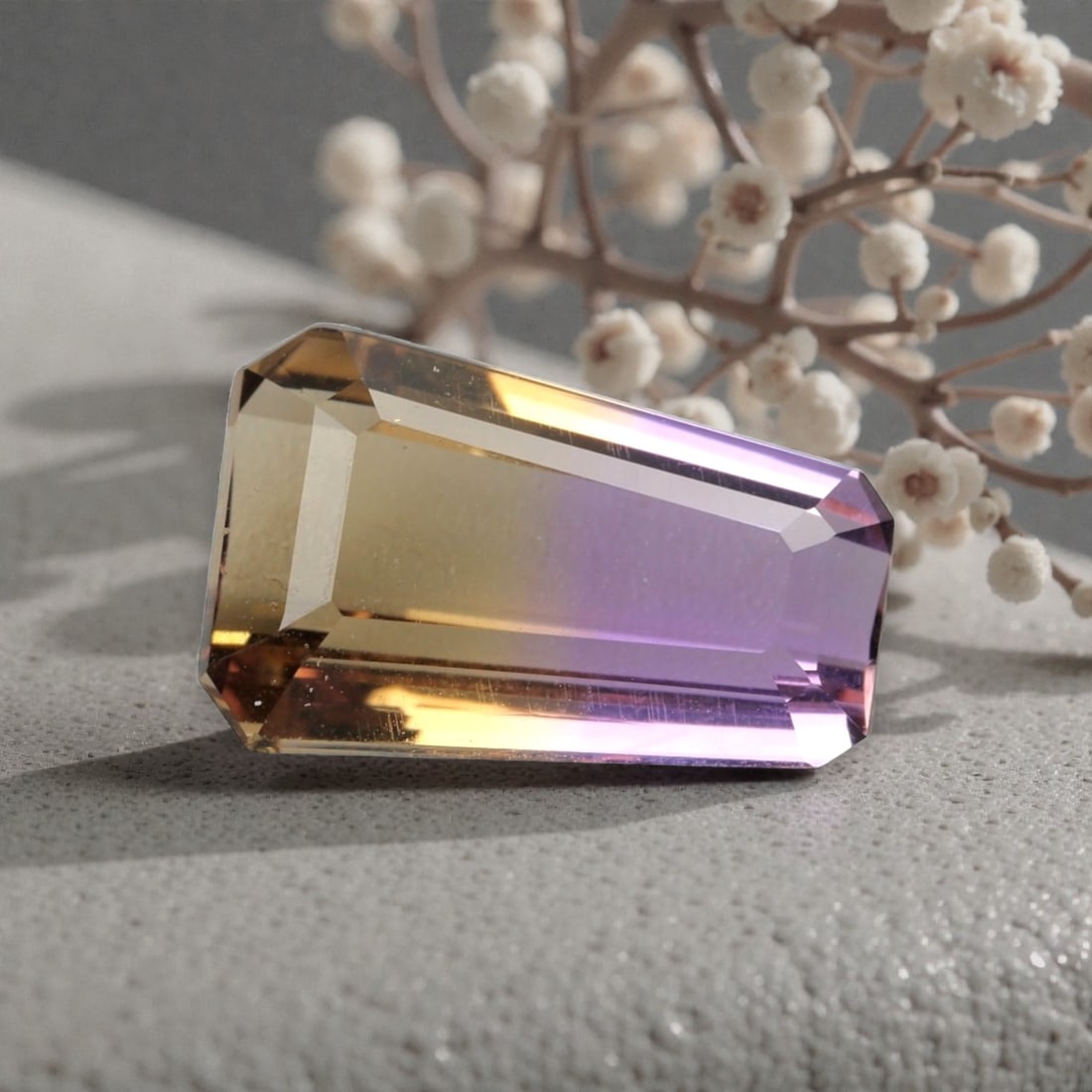 7.485 Carats Certified Violet and Yellow Ametrine - Natural Brazilian Gemstone, LZ269: This striking octagon step-cut ametrine showcases a seamless fusion of deep violet and warm golden-yellow hues, a signature characteristic of this dual-colored gem. The step-cut faceting enhances the 