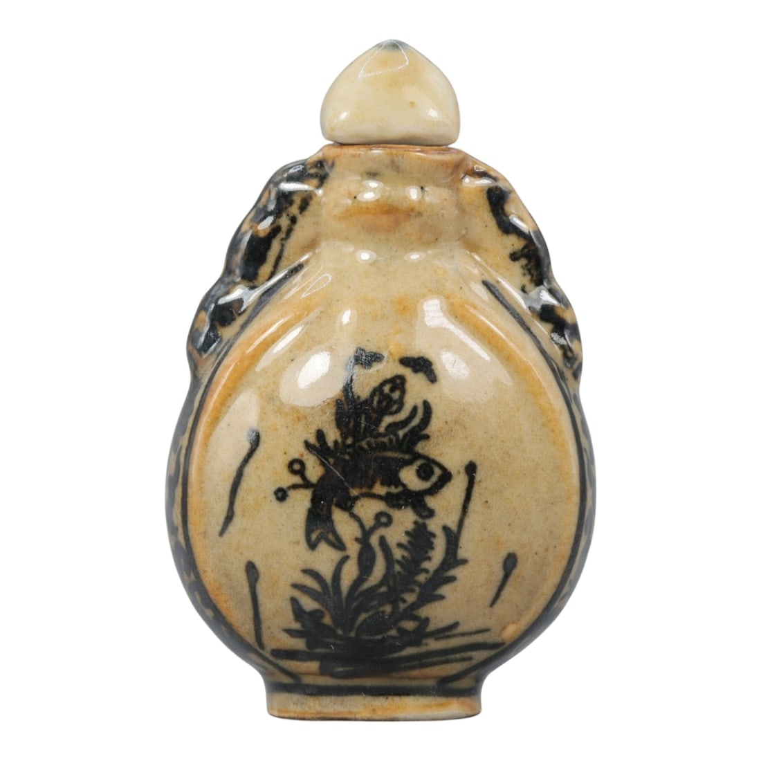 A Chinese Porcelain Moon Flask Snuff Bottle, 20th Century, 61BE: Crafted from porcelain with a pale cream glaze and decorated in underglaze black, the snuff bottle is formed in a flattened moon flask (bianhu) shape, with molded beast-head handles to either side, a 