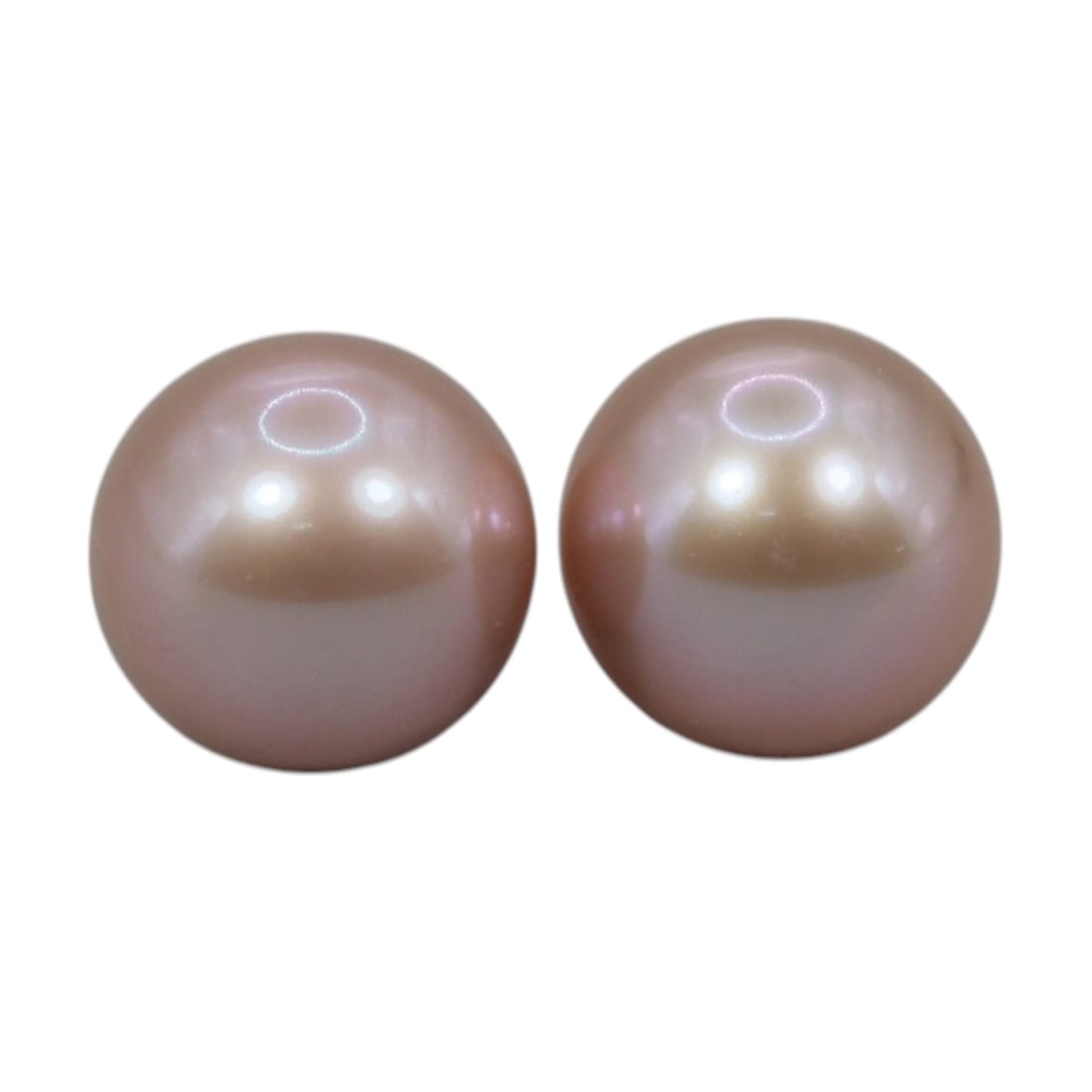 Freshwater Pearl Pair - Natural Pearl Pink Round Gemstones 7.6mm, 39XA: A matched pair of natural freshwater pearls, exhibiting a soft pinkish-peach hue with bright, even luster and subtle iridescent orient. The pearls are near-spherical, with smooth nacre and only minor 