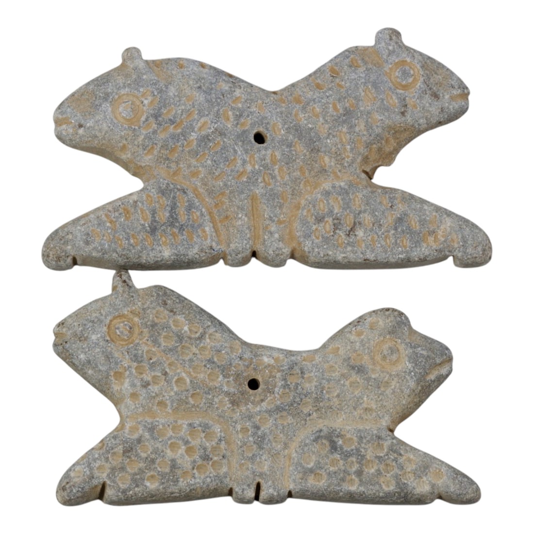 Lot of 2 Ancient Near Eastern Style Double-Headed Zoomorphic Stone Amulets, 99WM: A curated lot of two matching ancient Near Eastern-style stone amulets, each carved in the form of a symmetrical double-headed quadruped. The pieces feature incised dot patterns across their surfaces,