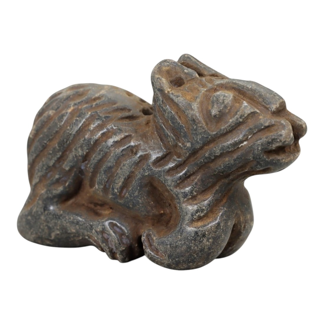 Ancient Schist Zoomorphic Figurine - Animal Carving, 36AH: Carved from schist stone, this ancient zoomorphic figurine features a stylized animal form with incised detailing, typical of small-scale ornamental use in early cultural contexts. The stone exhibits 