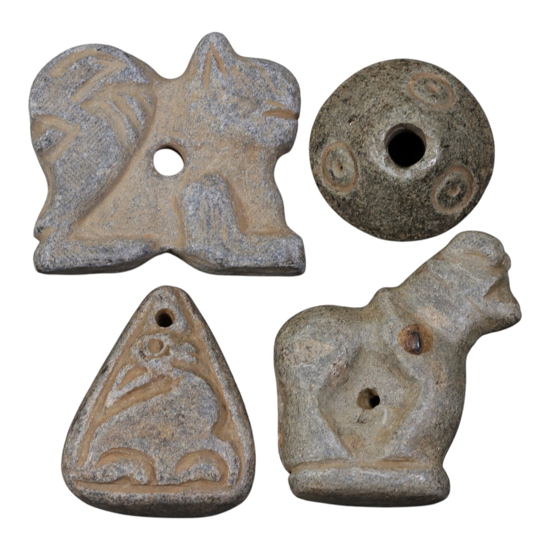 Lot of 4 Ancient Near Eastern Schist Effigies and Beads, Circa Iron Age, 20AE: The group comprises four carved schist objects, including three effigy pendants and one disc bead, typical of Near Eastern votive and personal adornment traditions. The first is a double-animal effigy