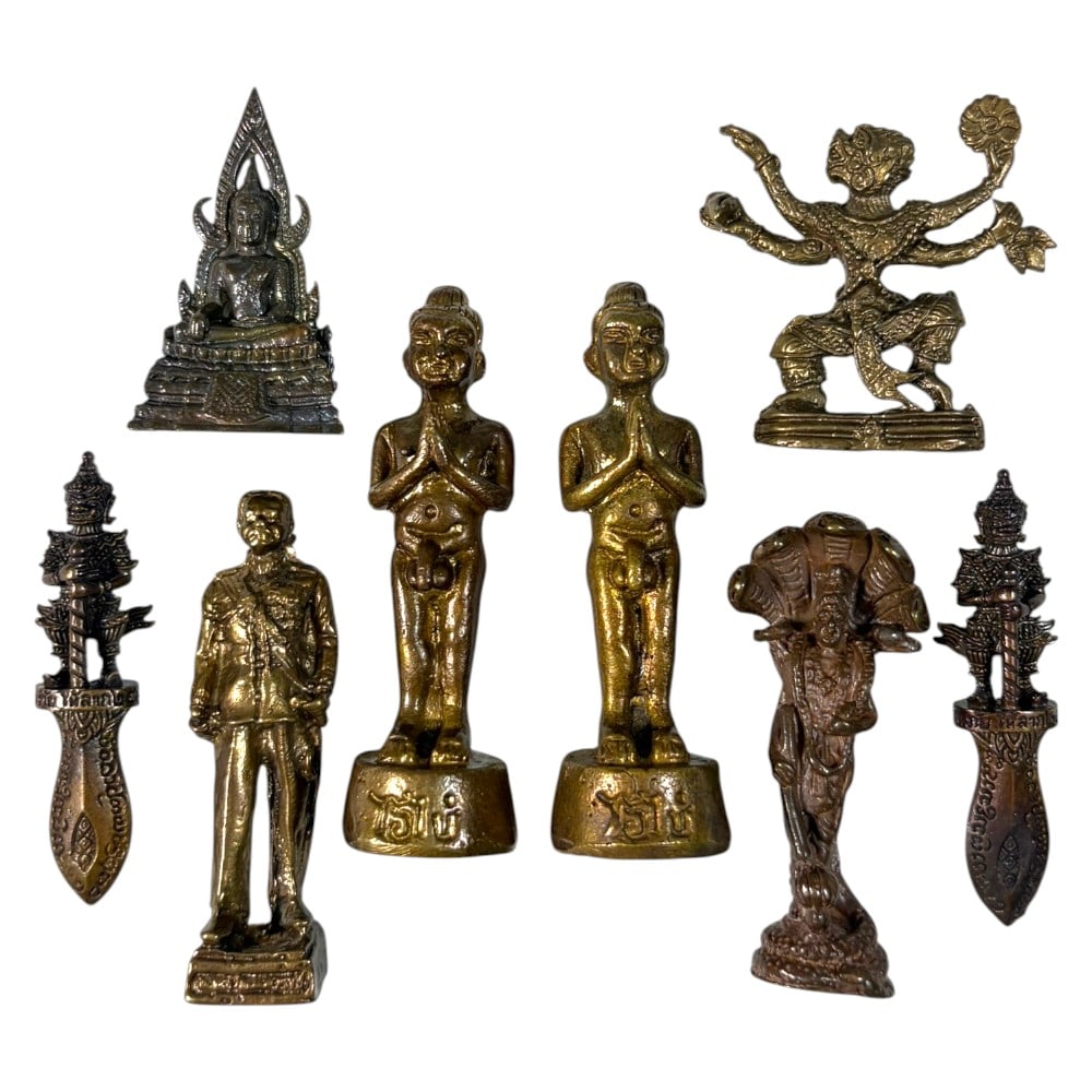 A Lot of 8 Vintage Southeast Asian Brass and Bronze Figurines, 49AA: Comprising eight small cast metal pieces ranging from 3.5 to 5.5 cm in height. The collection features a diverse array of sacred and cultural imagery, including a seated Buddha, multi-armed Hanuman, g