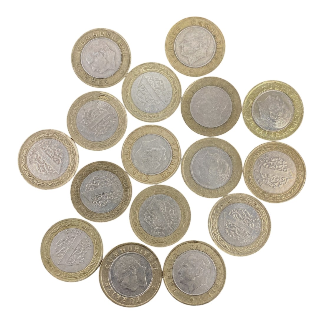 TURKIYE: Modern Republican Identity - Bimetallic Coin Bulk Lot, 17V: This collection of Turkish bimetallic coins features the iconic profile of Mustafa Kemal Ataturk, the founder of the Turkish Republic, on one side and intricate national emblems on the other. Struck w