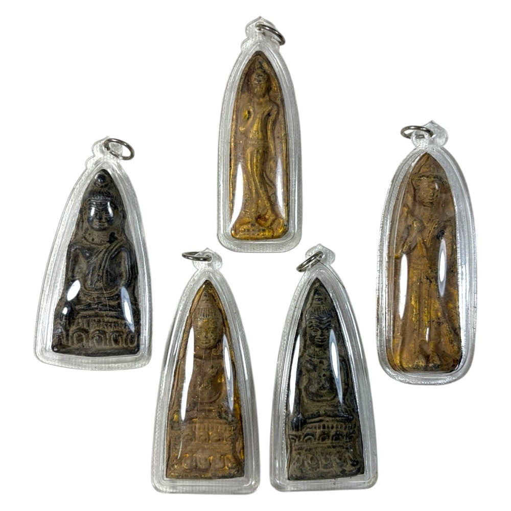 A Lot of 5 Vintage Thai Buddhist Amulets in Clear Cases, 36AA: Comprising five pendants ranging from 7.5 to 9 cm in height. Each amulet features aged devotional imagery, including seated and standing Buddha forms, many with residual gold leaf accents. They are en