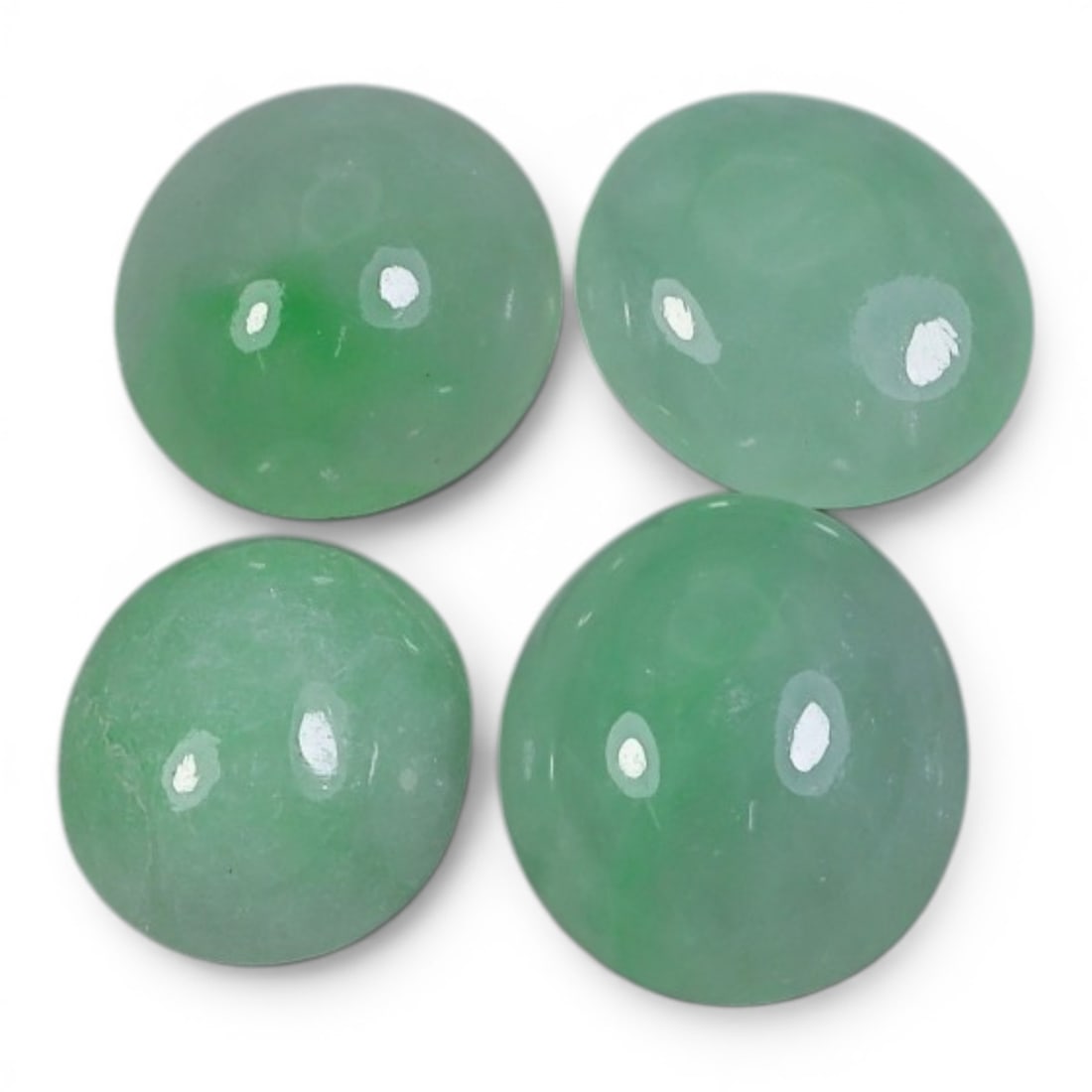 15.01 Carats Natural Type A Burmese Jadeite Cabochon Lot, 91AJ: Come take a look at this lovely little parcel of four natural jadeite cabochons, such soft, pretty green hues! Look at that gentle, even green tone on all four stones, just like the first leaves of sp