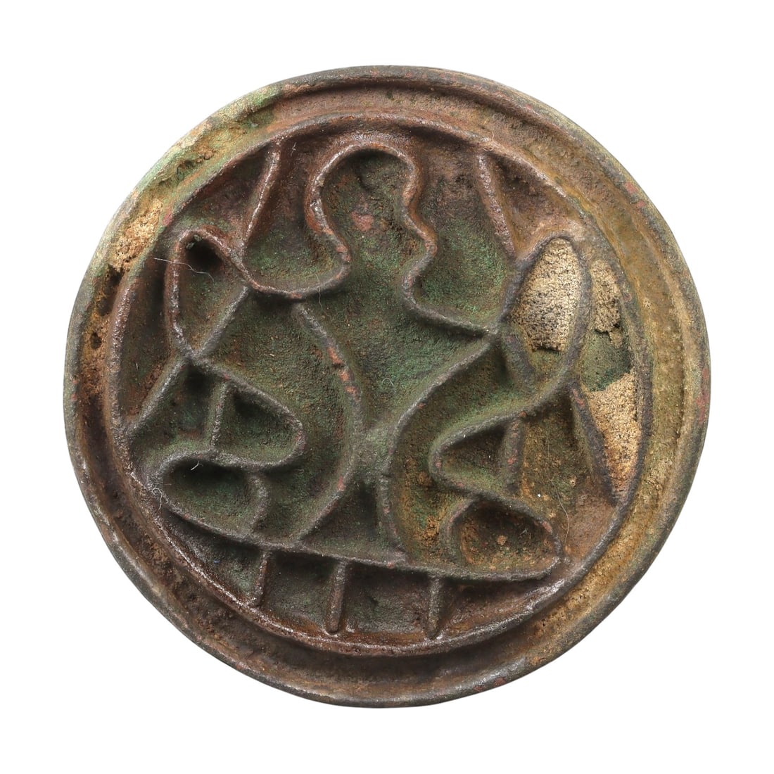 An Ancient Bactrian Bronze Stamp Seal, 54AG: A circular bronze stamp seal of the Bactrian period, with a raised relief design depicting a stylized central motif flanked by curvilinear elements, framed within a double border. The surface displays