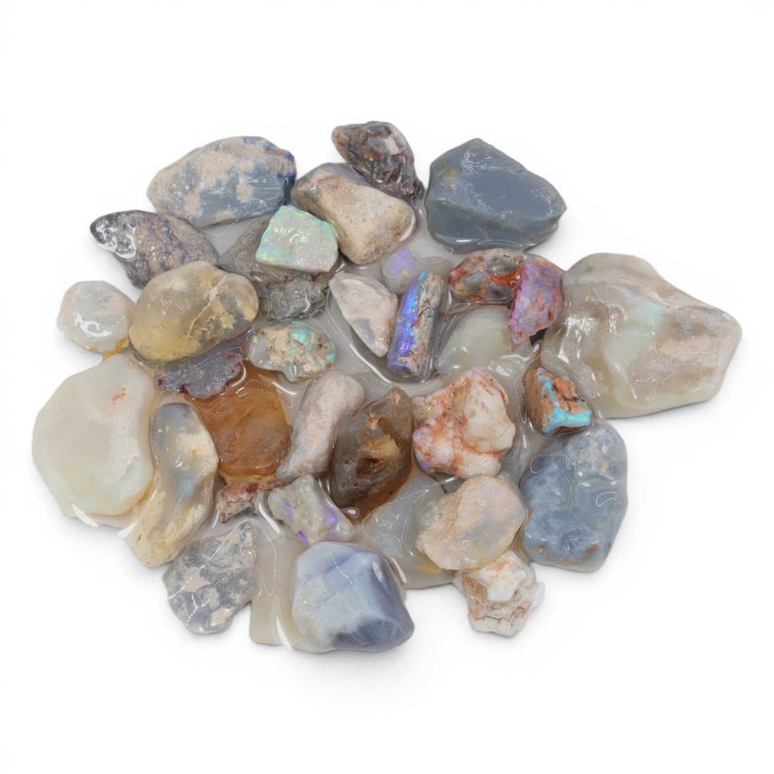 Natural Australian Lightning Ridge Opal Rough, 39g, 91WS: This collection of raw opal rough hails from Australia's legendary Lightning Ridge, showcasing the region's iconic play-of-color potential. The stones exhibit a range of natural hues, from milky white