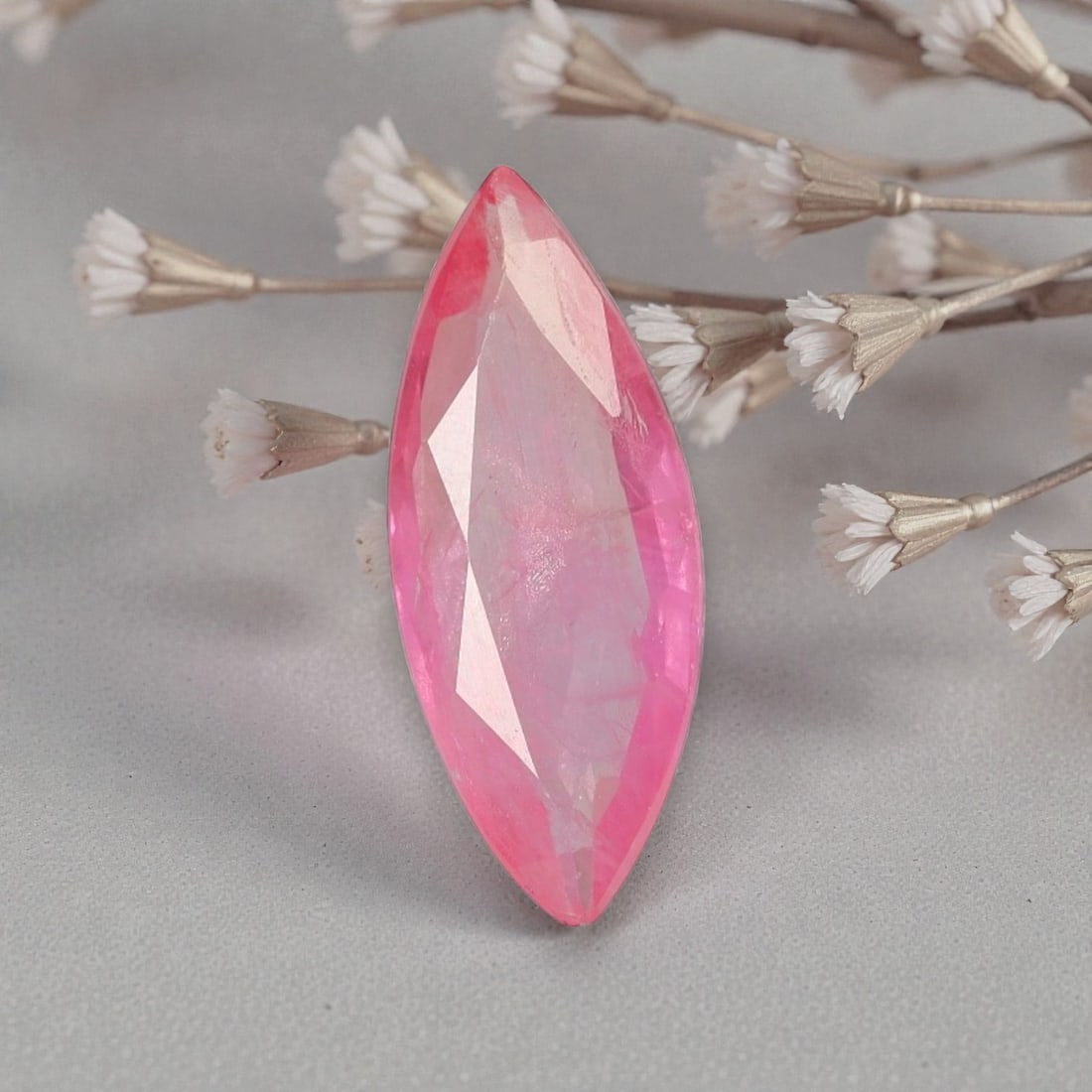 2.25 Carats Certified Orange Pink Sapphire - Natural Ceylon Gemstone, LZ114: This striking 2.25 carat marquise-cut sapphire captivates with a delicate orange-pink hue, a rare and sought-after shade that evokes the soft glow of a tropical sunrise. The elegant marquise cut enhan