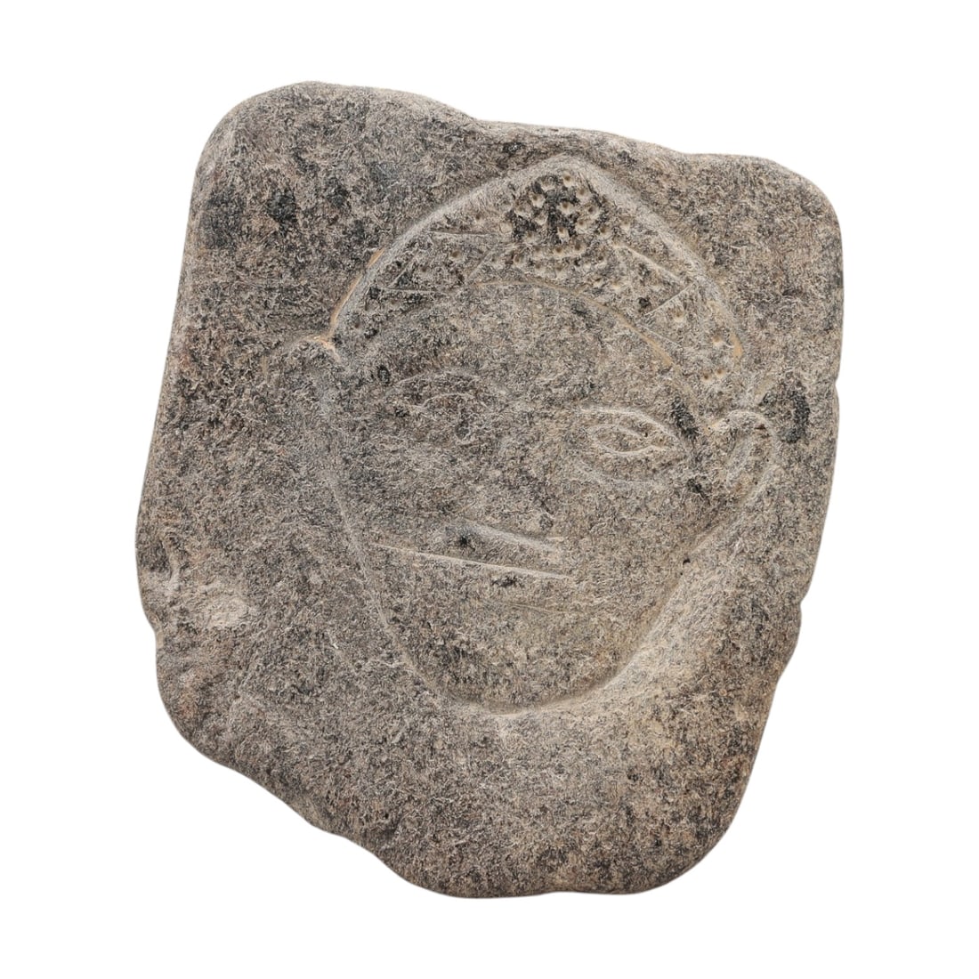 Ancient Sino-Siberian Carved Stone Plaque, 52AG: A carved stone plaque of irregular form, featuring an incised human face with stylized features, including defined eyes, nose, mouth, ears, and a decorated headdress. The stone surface is weathered wi