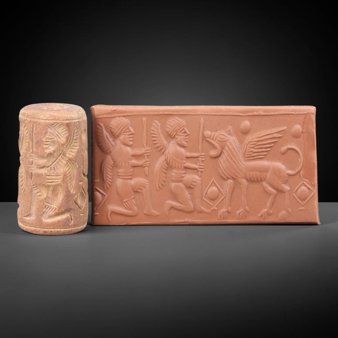 Ancient Stone Cylinder Seal - Mesopotamian Amulet Relic, 10BH: Carved from a light, weathered stone, this miniature cylindrical seal features incised decoration depicting a kneeling winged human figure, with detailed linear carving defining the figure's headdress
