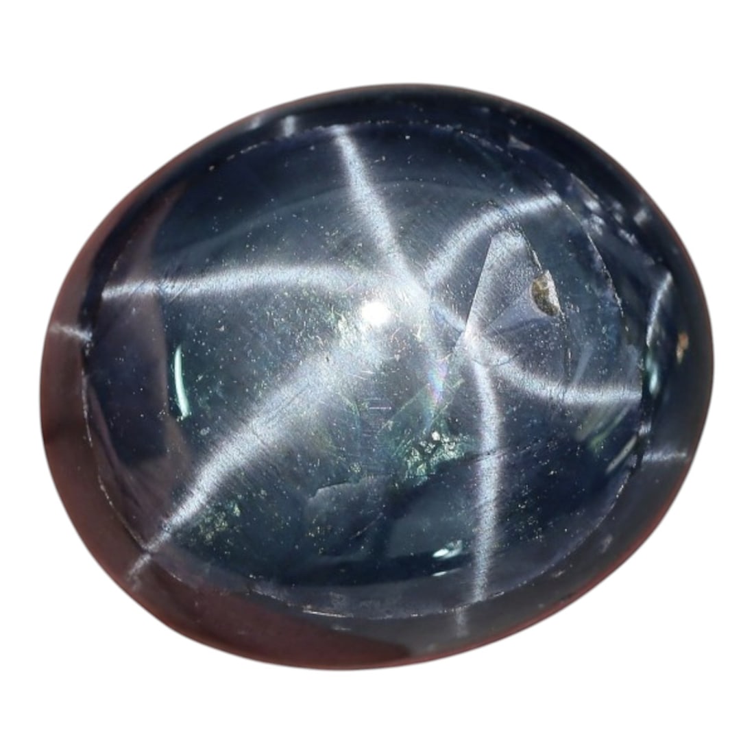 17.98 Carats Midnight Blue Star Sapphire Oval Cabochon - Natural Loose Gemstone, 4XC: This extraordinary, large-sized star sapphire presents a breathtaking celestial display, featuring a rich, deep midnight blue hue that serves as a dramatic backdrop for its exceptionally vivid six-ray