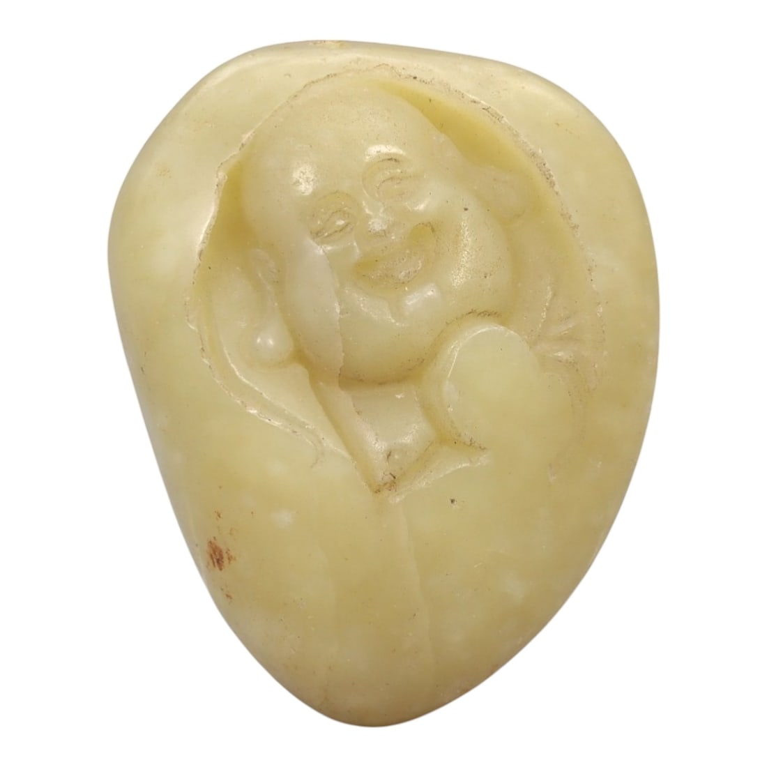 A Chinese Hetian Jade Pebble Carving of Budai, 20th Century, 92FH: Carved from a naturally rounded Hetian nephrite pebble of pale yellowish celadon tone, the carving depicts Budai shown in relief emerging from the natural contours of the stone. The figure is rendered