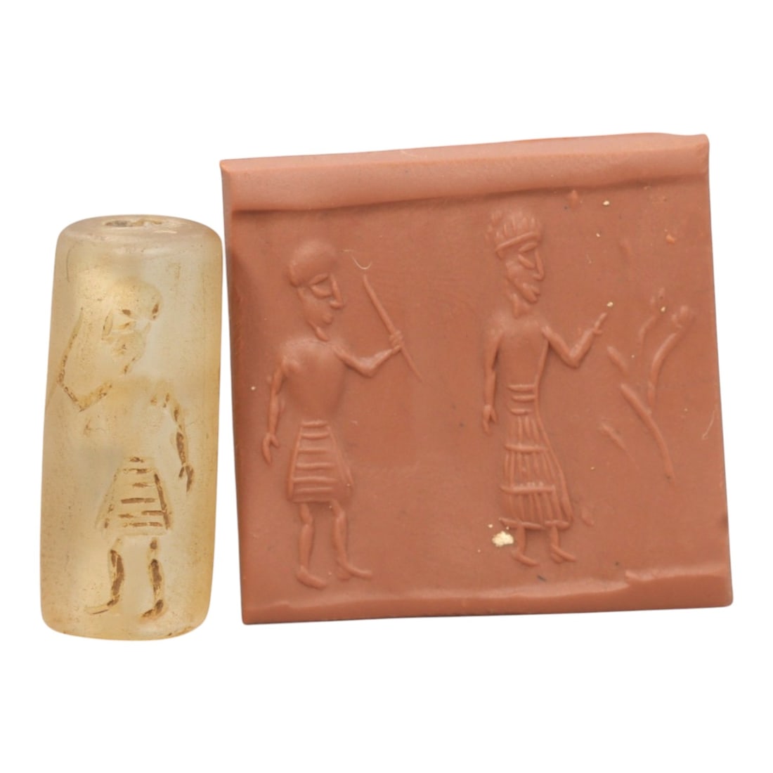 Ancient Rock Crystal Cylinder Seal - Near Eastern Figural Scene, 89ZR: Carved from translucent pale rock crystal with a naturally frosted, weathered patina, executed in a cylindrical form characteristic of Near Eastern cylinder seal craftsmanship. The seal's surface bear