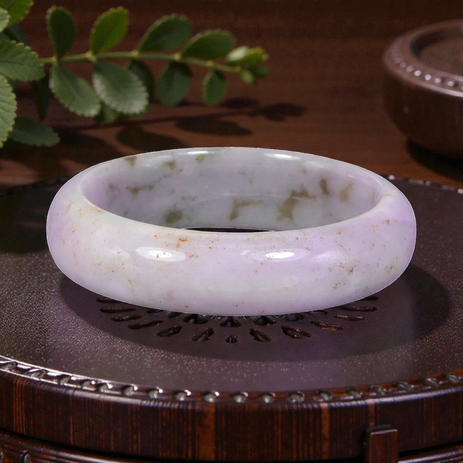 Natural Burmese Type A Lavender Jadeite Bangle - Green Inclusion Bracelet, 18EA: This is a wide, solid bangle crafted from natural Burmese Type A jadeite, displaying a soft lavender base with pale green and subtle russet inclusions. The stone exhibits a translucent, polished finis