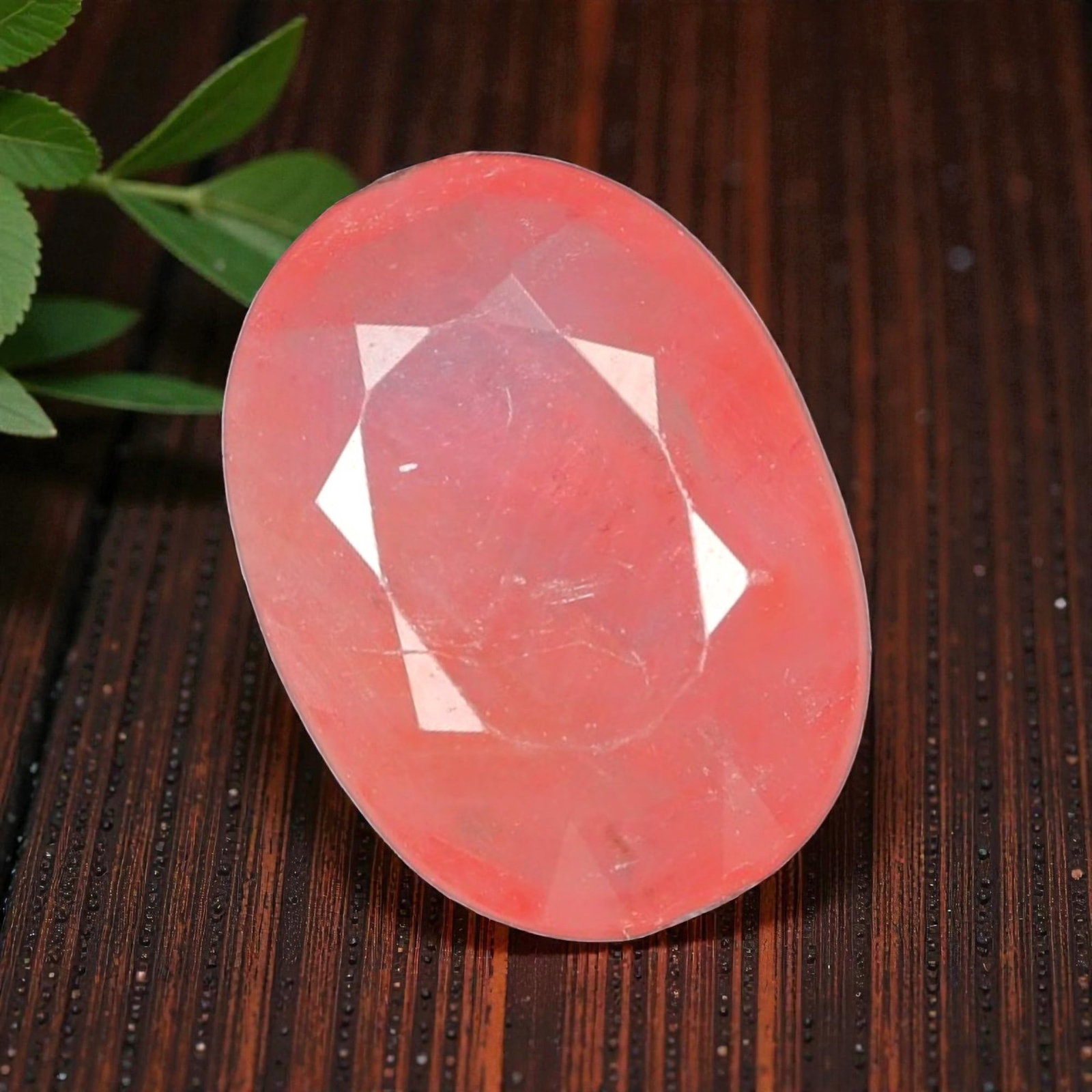 2.82 Carats Certified Orange Pink Sapphire - Natural Ceylon Gemstone, LZ113: This enchanting 2.82 carat oval faceted sapphire captivates with a delicate orange-pink hue, a rare and sought-after shade that evokes the soft glow of a tropical sunrise. The precision oval cut enhan