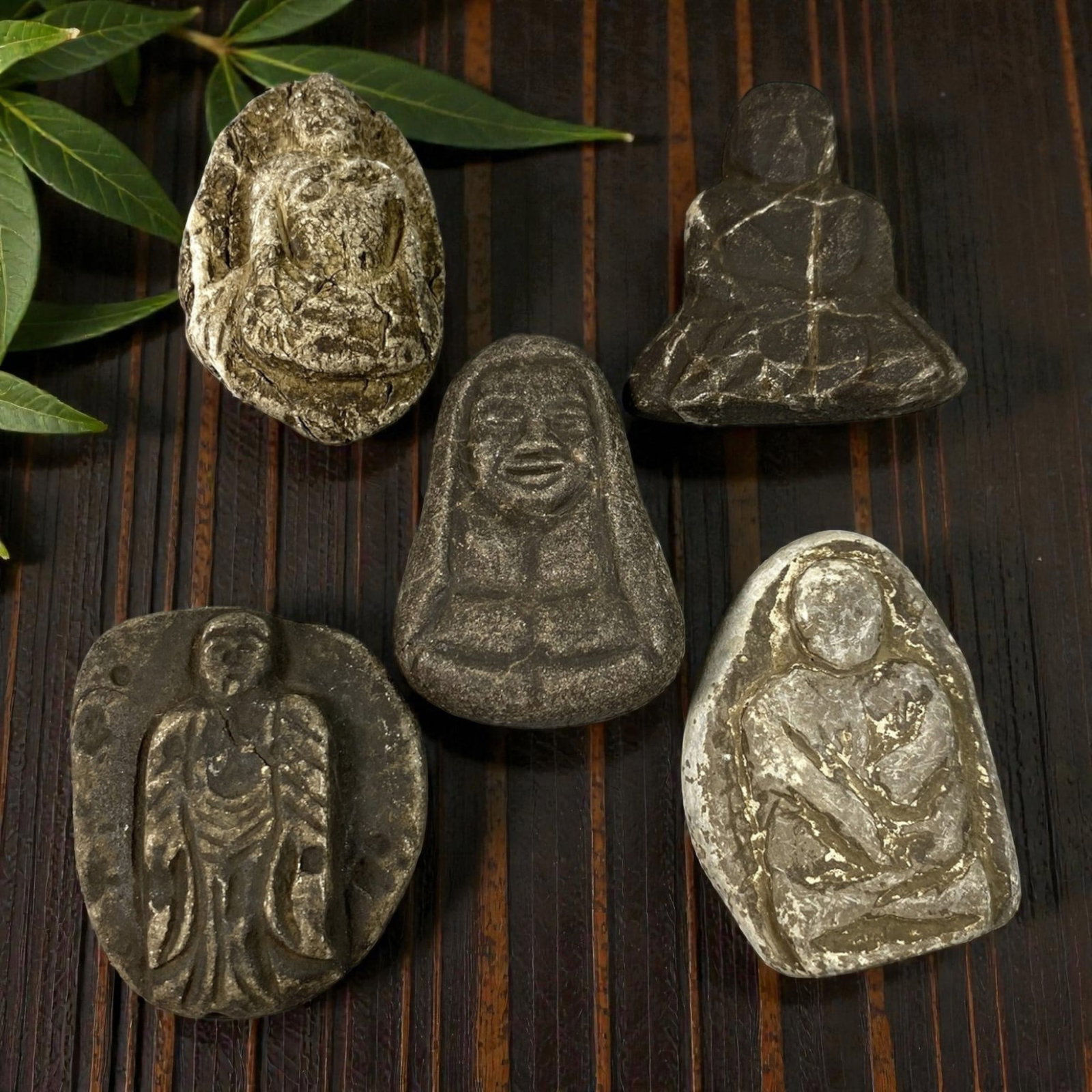 Lot of 5 Antique Japanese Edo Period Stone Buddhist Figurines, 71AG: A collection of five hand-carved stone Buddhist amulets attributed to the Edo period (1603-1868), Japan. Crafted from weathered stone with deep patination and traces of white pigment, these pieces sho