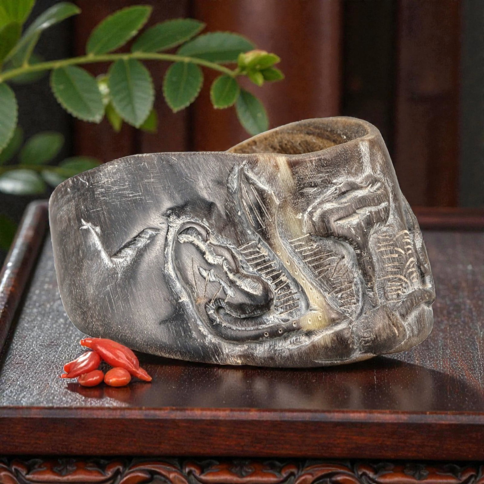 A Chinese Horseshoe Hoof (Ma Ti) Carved Brush Washer, 20th Century, 18YB: Carved from a natural horseshoe hoof (ma ti), the object is worked into a shallow, irregularly oval vessel with thick walls and an uneven rim, following the original organic form of the material. The 