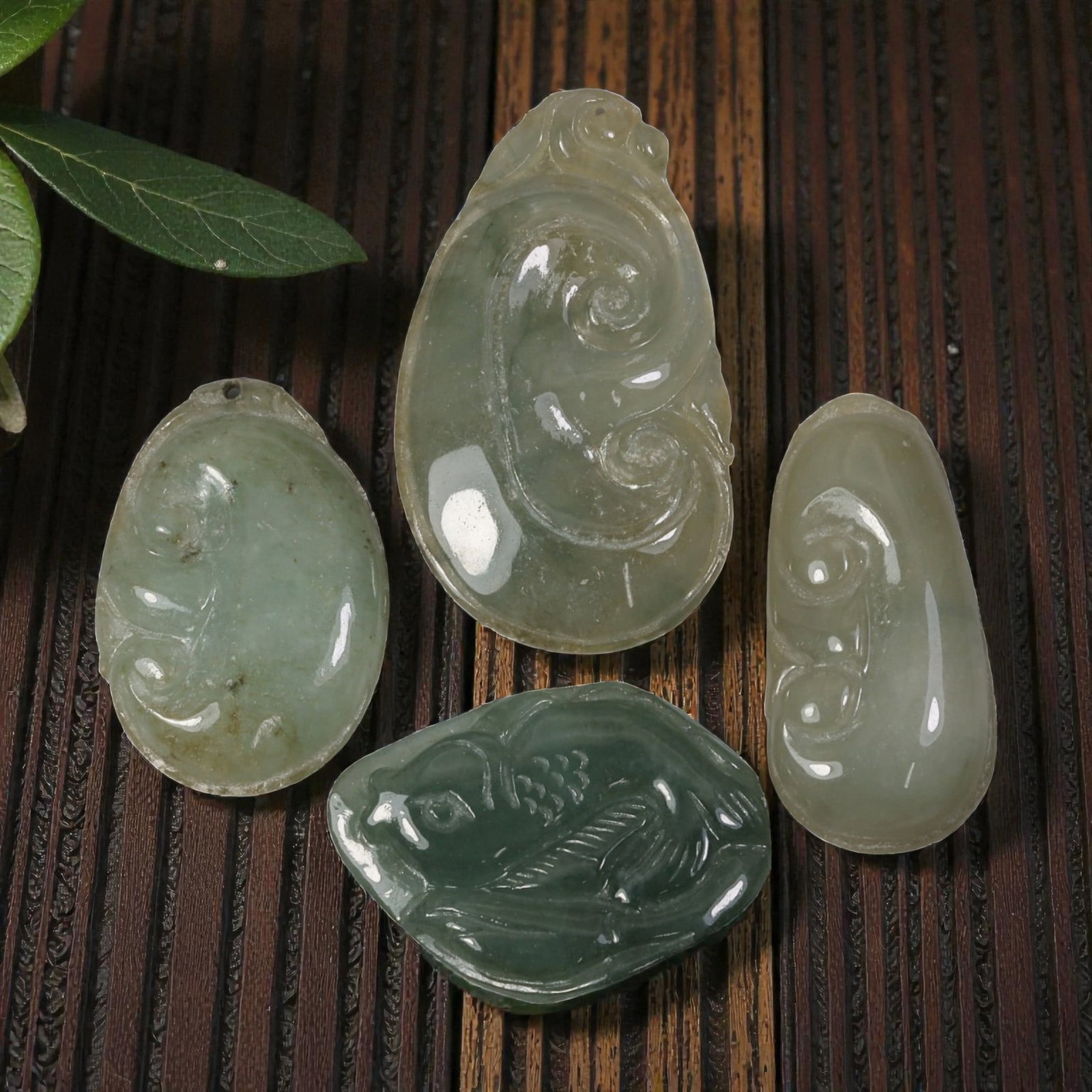 142 Carats Natural Vintage Type A Jadeite Jade Pendant Lot, 22AG: Come take a look at this charming set of 4 vintage jadeite pendants, full of soft color and classic carving styles! These beauties range in size from 31x21x5.8mm up to 42x24x4.9mm, totaling 142.8 cara