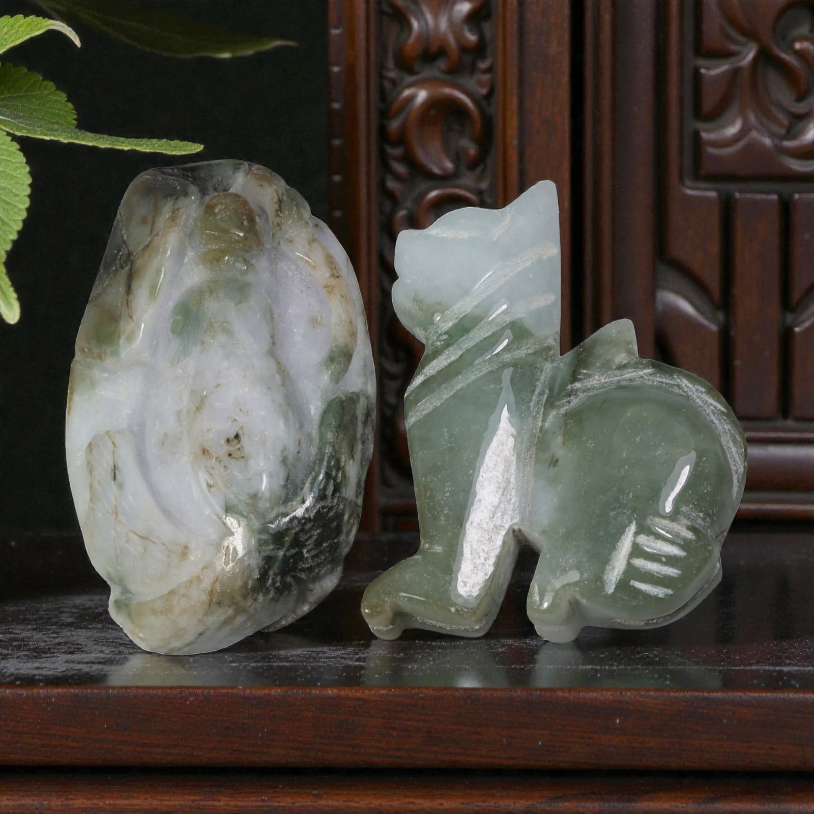 Lot of 2 Vintage Oriental Chinese Jadeite Jade Figurines, 43AG: The lot comprises two carved jadeite figurines. The left piece is a free-form pendant carved from mottled lavender, white, and green jadeite, depicting a mythical creature or fruit form with detailed 