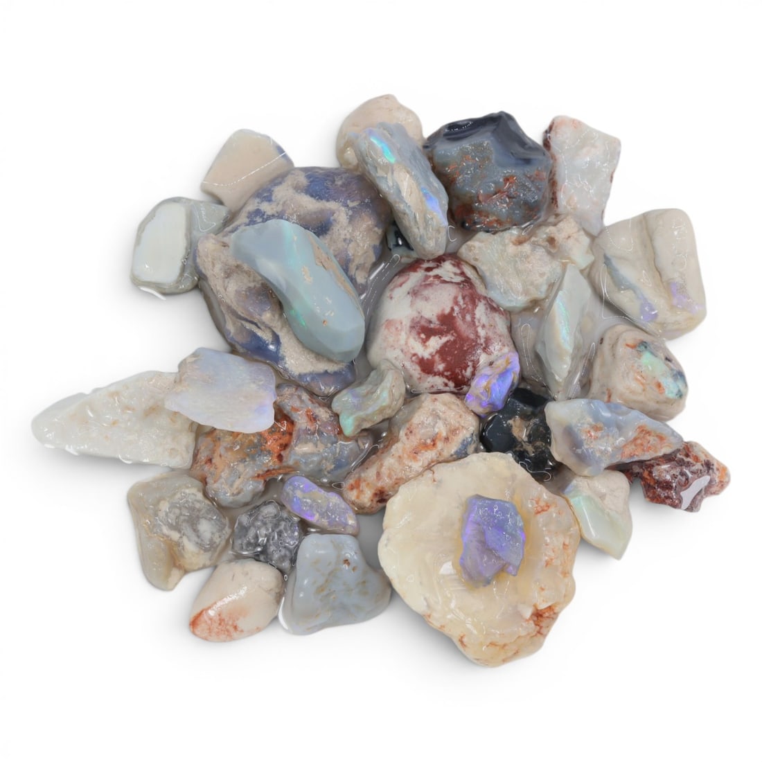 Natural Australian Lightning Ridge Opal Rough, 59g, 87WS: This collection of raw opal rough hails from Australia's legendary Lightning Ridge, showcasing the region's iconic play-of-color potential. The stones exhibit a range of natural hues, from milky white