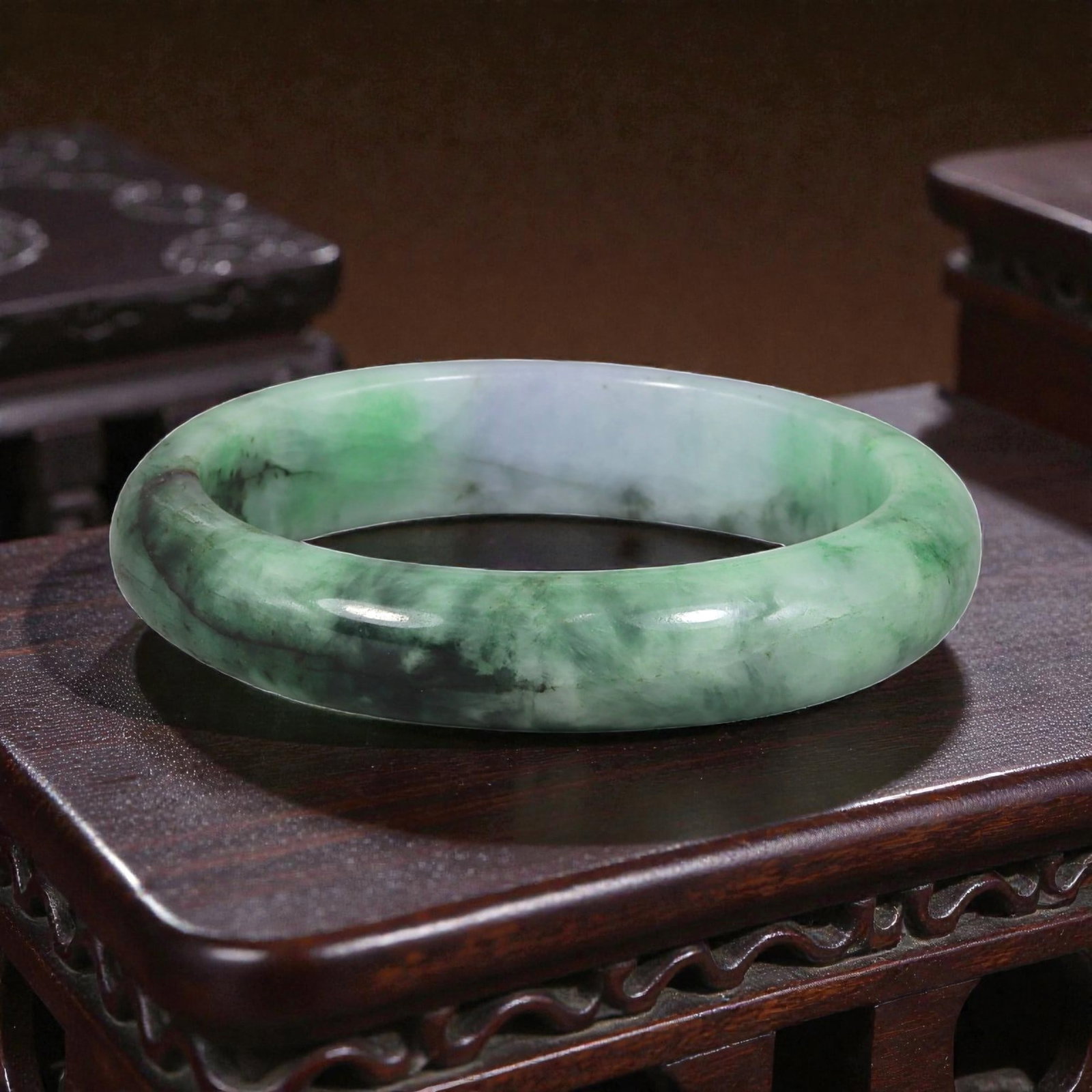 Natural Burmese Type A Lavender & Green Jadeite Bangle - Ink Wash Verdant Bracelet, 90XE: This is a rounded, solid bangle crafted from natural Burmese Type A jadeite, displaying a soft lavender-tinged base with dramatic ink-wash green and dark patterning that flows across the stone. The su
