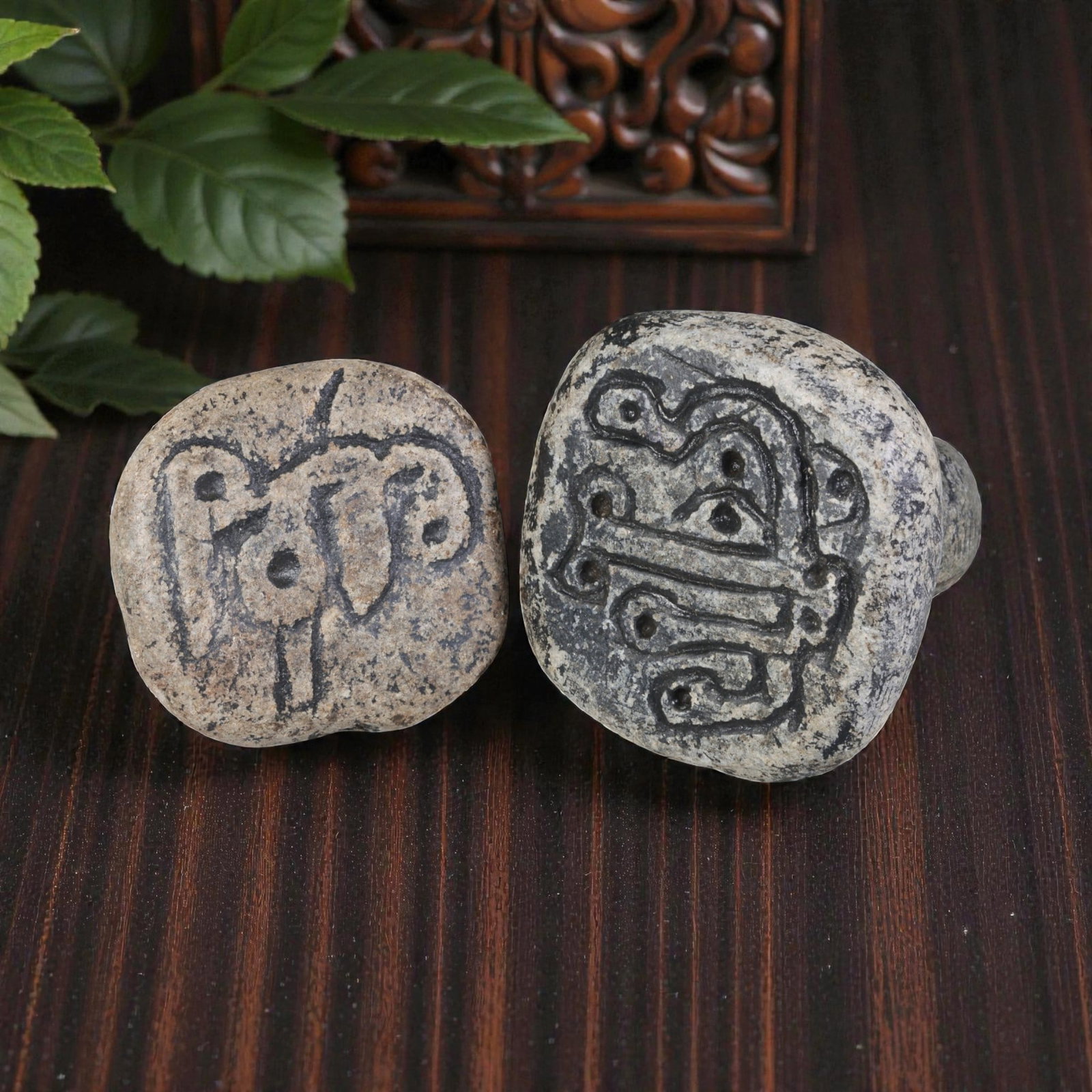 Lot of 2 Ancient Near Eastern Schist Stamp Seals, 53WP: A pair of ancient Near Eastern stamp seals, carved from weathered schist stone. Each seal features a rounded, knobbed handle with a drilled hole for suspension, and a square/rounded base incised with 