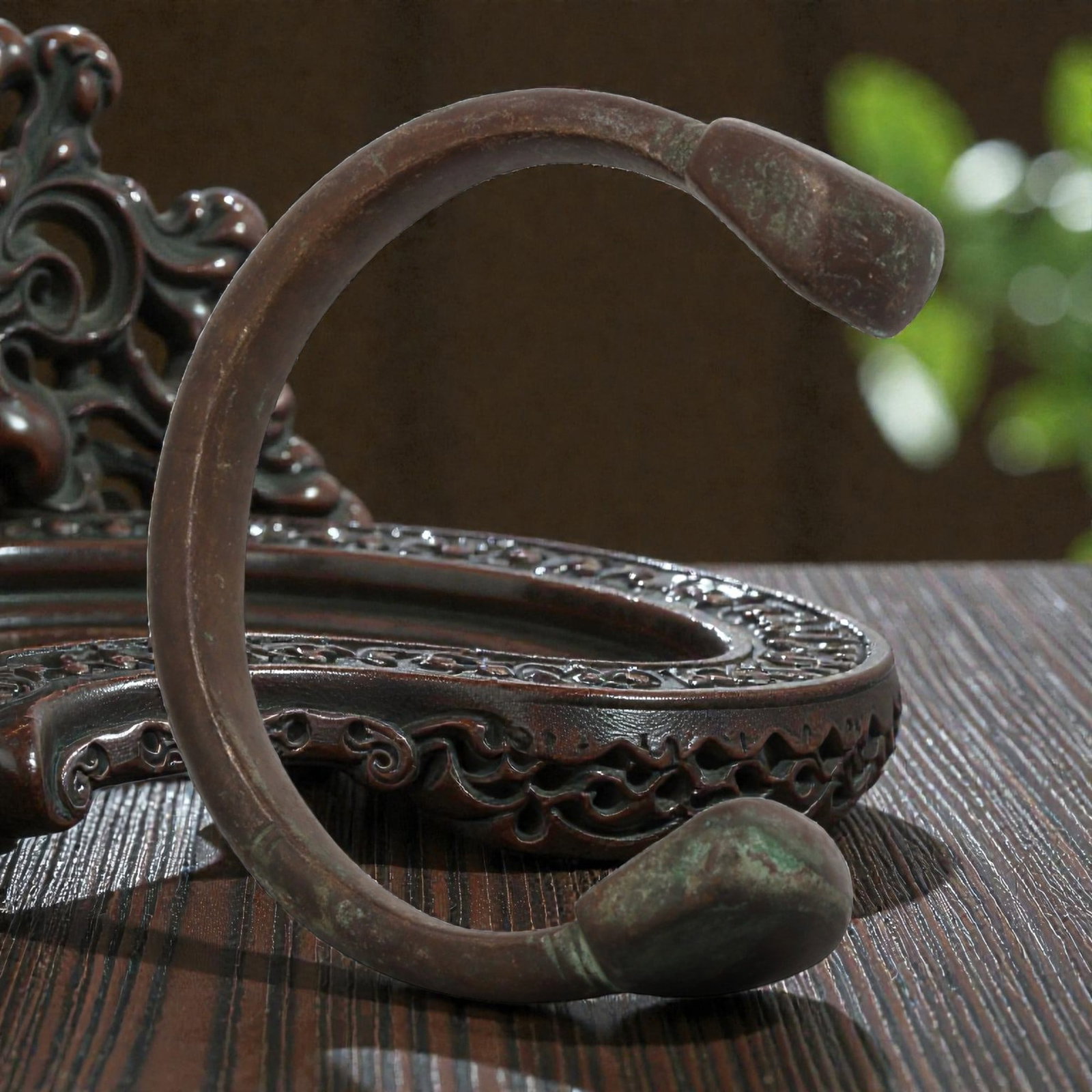 Antique African Bronze Bracelet - Decorated Penannular Bangle, 8BN: An antique African bronze bracelet, formed from a thick, rounded bronze band with a substantial profile. The open terminals are capped with stylized, bulbous finials, a decorative motif common in trad