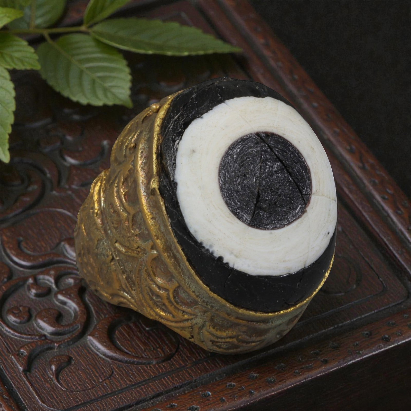 Antique Qajar Dynasty Gilt Evil Eye Ring, US Size 6.5, 51AJ: A gilt-metal ring of the Qajar period, US ring size 6.5, featuring a large domed evil-eye glass inlay with a bold concentric black-and-white design (the glass exhibits age-related cracks). The bezel a