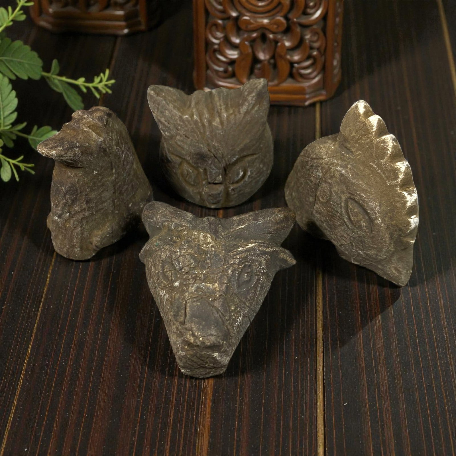 Lot of 4 Medieval Mediterranean Zoomorphic Stone Carvings, 74AG: A collection of four hand-carved stone zoomorphic heads, attributed to medieval folk or tribal art traditions of the Mediterranean region. Crafted from weathered dark stone with deep patination, surfa