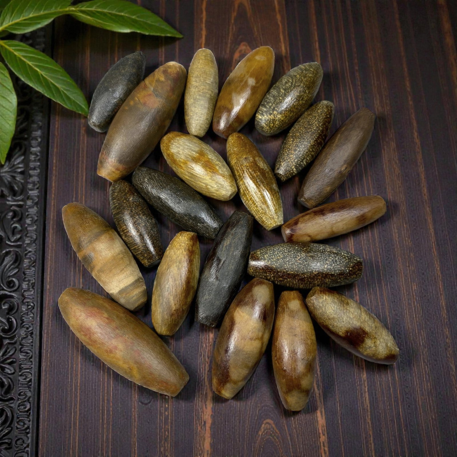 Lot of 20 Antique Himalayan Tibetan Fossilized Wood Ritual Beads, 62AG: A collection of 20 antique Himalayan Tibetan ritual beads, carved from natural fossilized wood with rich, earthy hues ranging from warm amber and golden brown to deep black and speckled tones. Each be