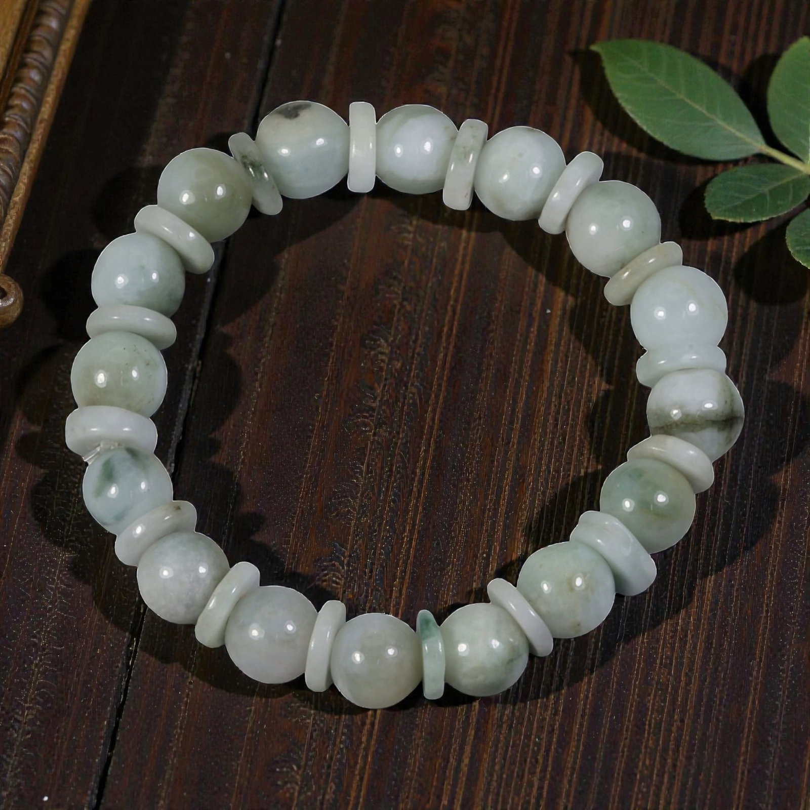 Natural Type A Burmese Jadeite Beaded Bracelet, 1AK: I'm happy to show you this delicate, one-of-a-kind jadeite bracelet! This 51mm diameter bracelet features a sweet mix of round and disc-shaped jadeite beads, creating a soft, rhythmic design. The main