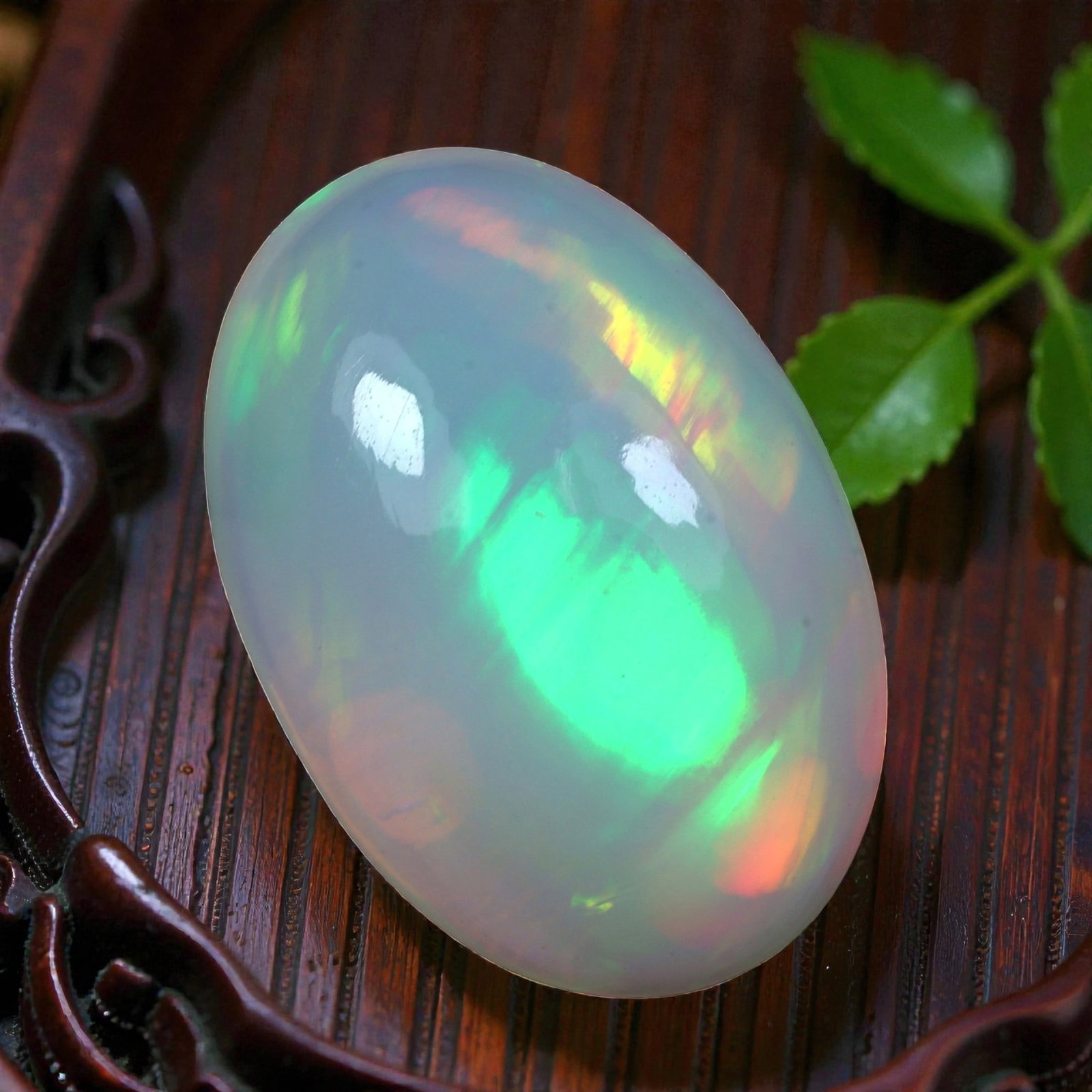 4.61 Carats Welo Opal Oval Cabochon - Natural Ethiopian Stone, 34XB: This stunning oval cabochon of Welo opal enchants with a luminous, shifting play of color, dominated by vivid lime green flashes complemented by soft hints of peach and golden yellow across its milky,