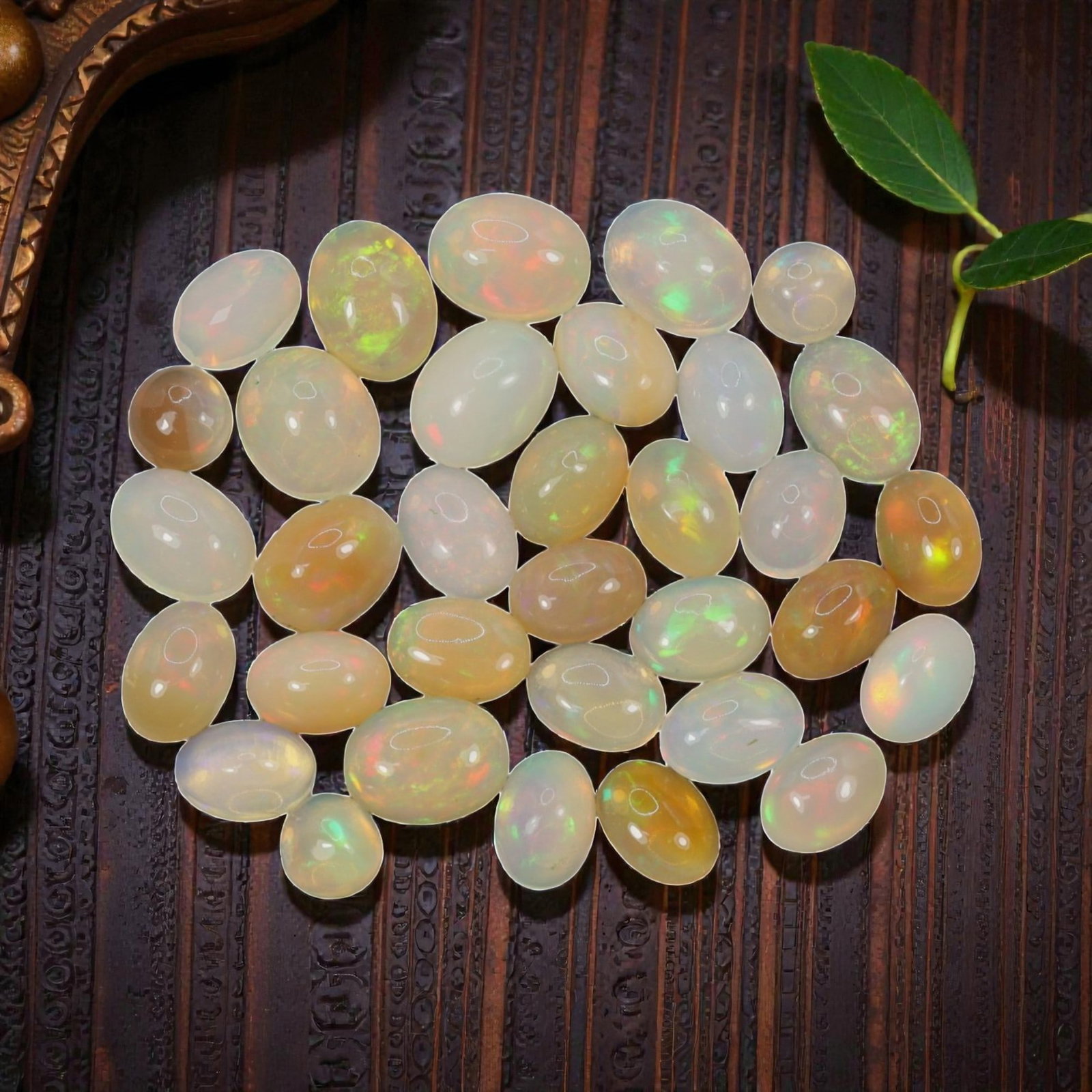 19.13 Carats Welo Opal Cabochon Parcel - Natural Ethiopian Stones, 48XA: This luminous collection of Welo opals showcases a rich spectrum of warm and cool translucent body tones, from milky white and soft cream to honey and golden amber, each adorned with vivid, shifting c