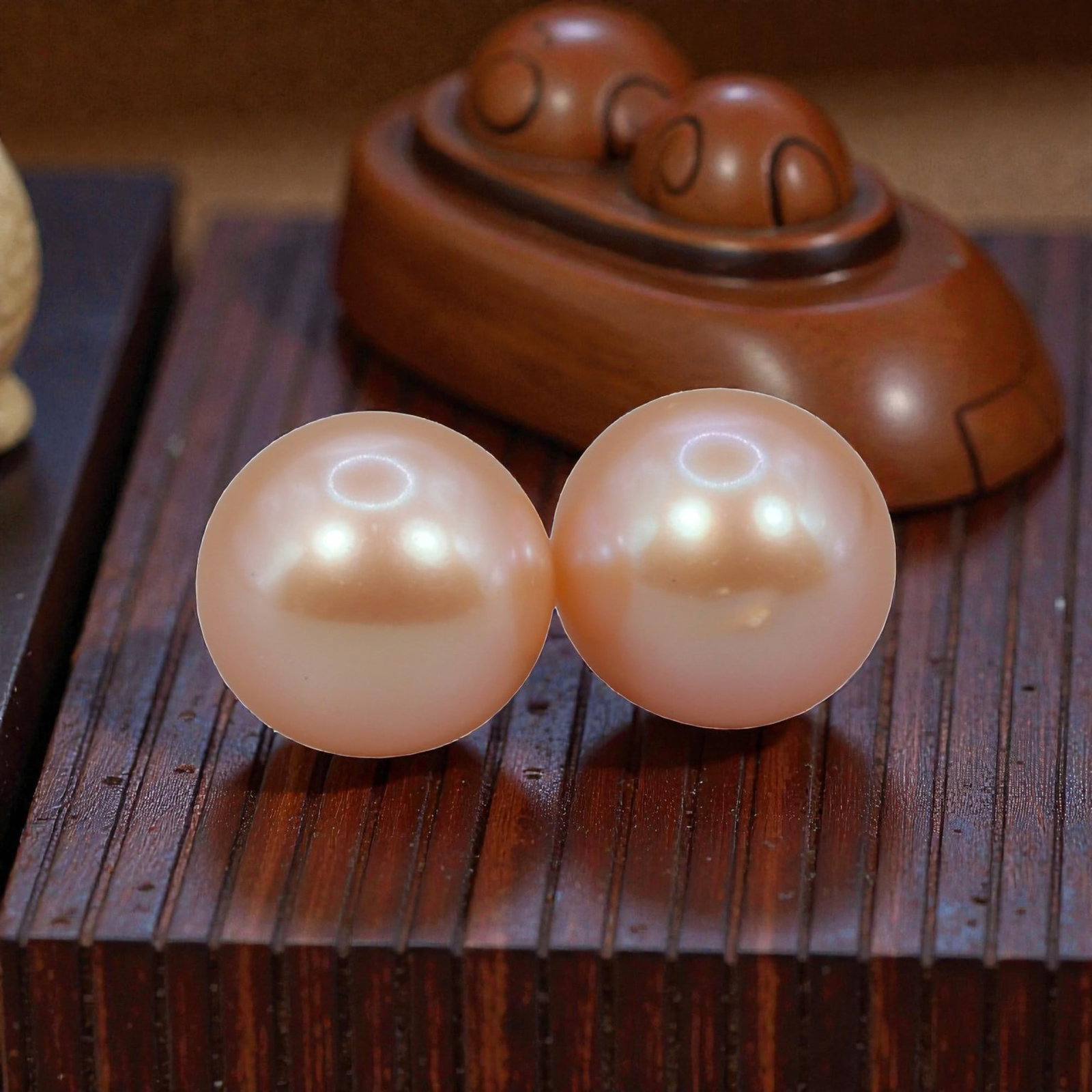Freshwater Pearl Pair - Natural Pearl Peach Round Gemstones 8.1mm, 37XA: A matched pair of natural freshwater pearls, exhibiting a soft peach-pink hue with bright, uniform luster and subtle iridescent orient. The pearls are near-spherical, with smooth nacre and minor natur