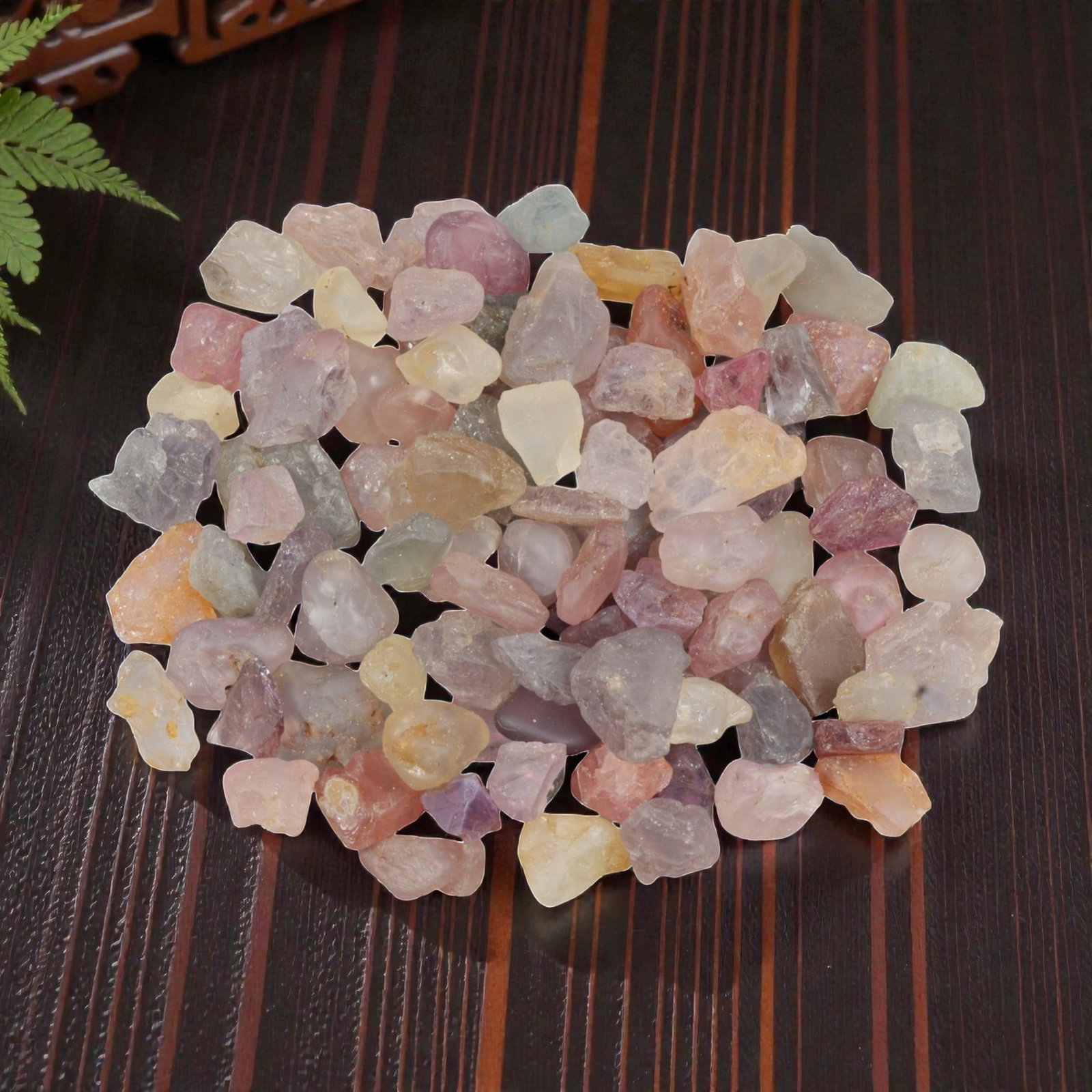 143.89 Carats Natural Multicolor Tourmaline Rough Parcel, 35XE: This generous parcel of natural tourmaline rough presents a soft, enchanting spectrum of pastel hues, including delicate pinks, lavender, mint greens, warm peaches, and buttery yellows. The stones are