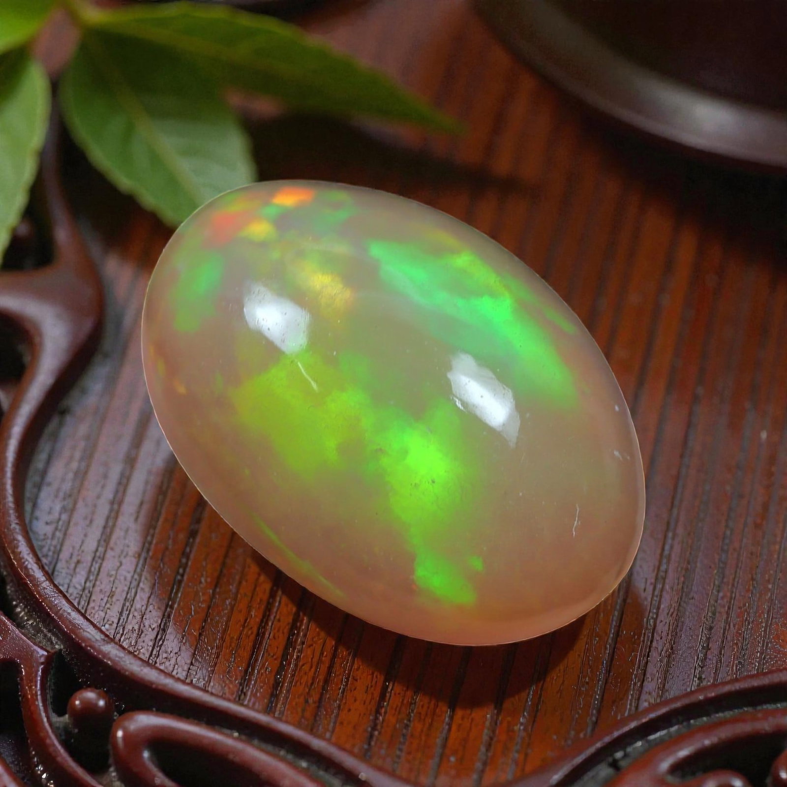 2.72 Carats Play-of-Color Welo Opal - Natural Ethiopian Gem 11x8mm, 30XC: This captivating Welo opal gleams with a luminous cascade of multi neon color that ripple across the stone's surface with every movement. The play-of-color is vivid and well-distributed, presenting a 