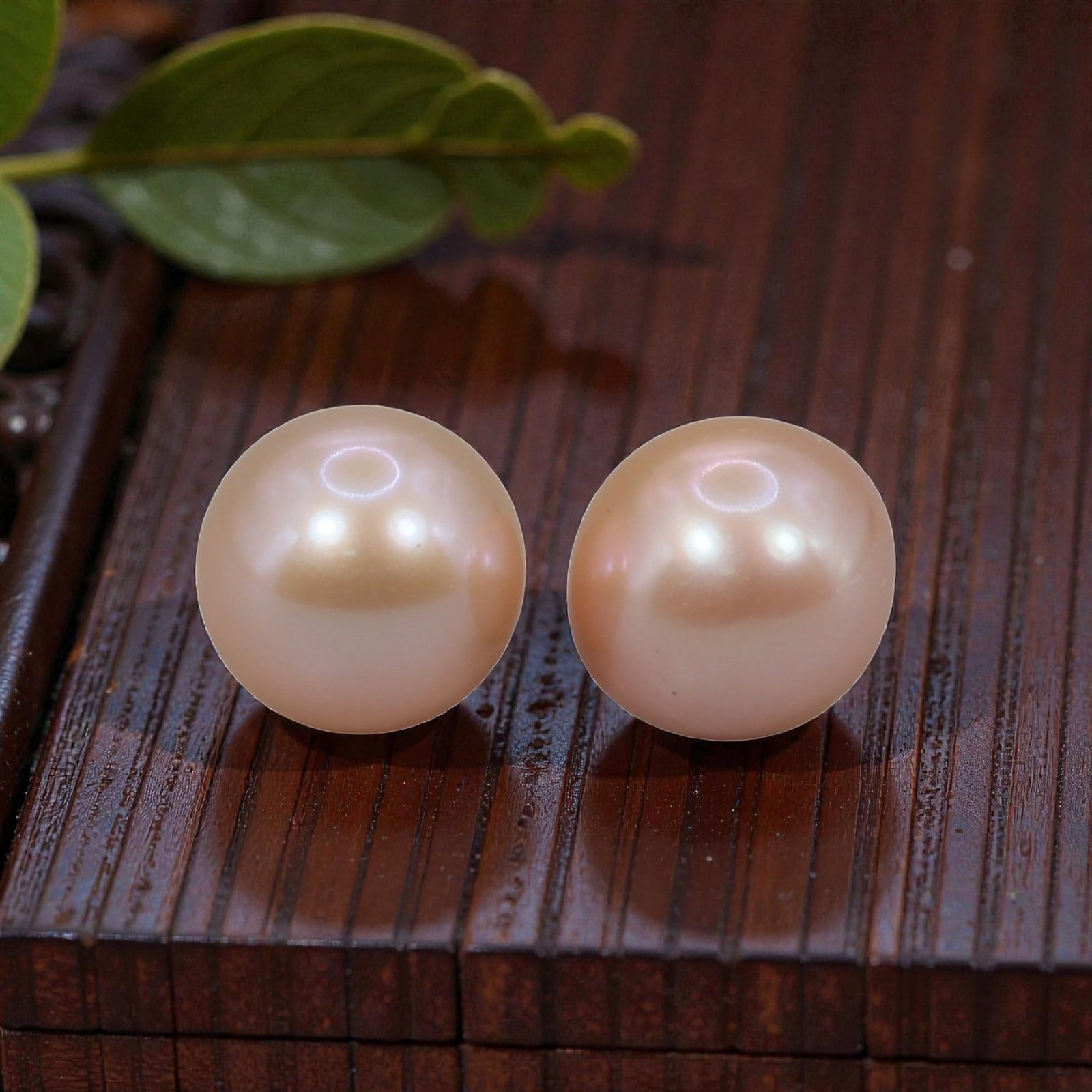 Freshwater Pearl Pair - Natural Pearl Peach Round Gemstones 8.1mm, 45XA: A matched pair of natural freshwater pearls, exhibiting a soft peach-pink hue with bright, uniform luster and subtle iridescent orient. The pearls are near-spherical, with smooth nacre and minor natur