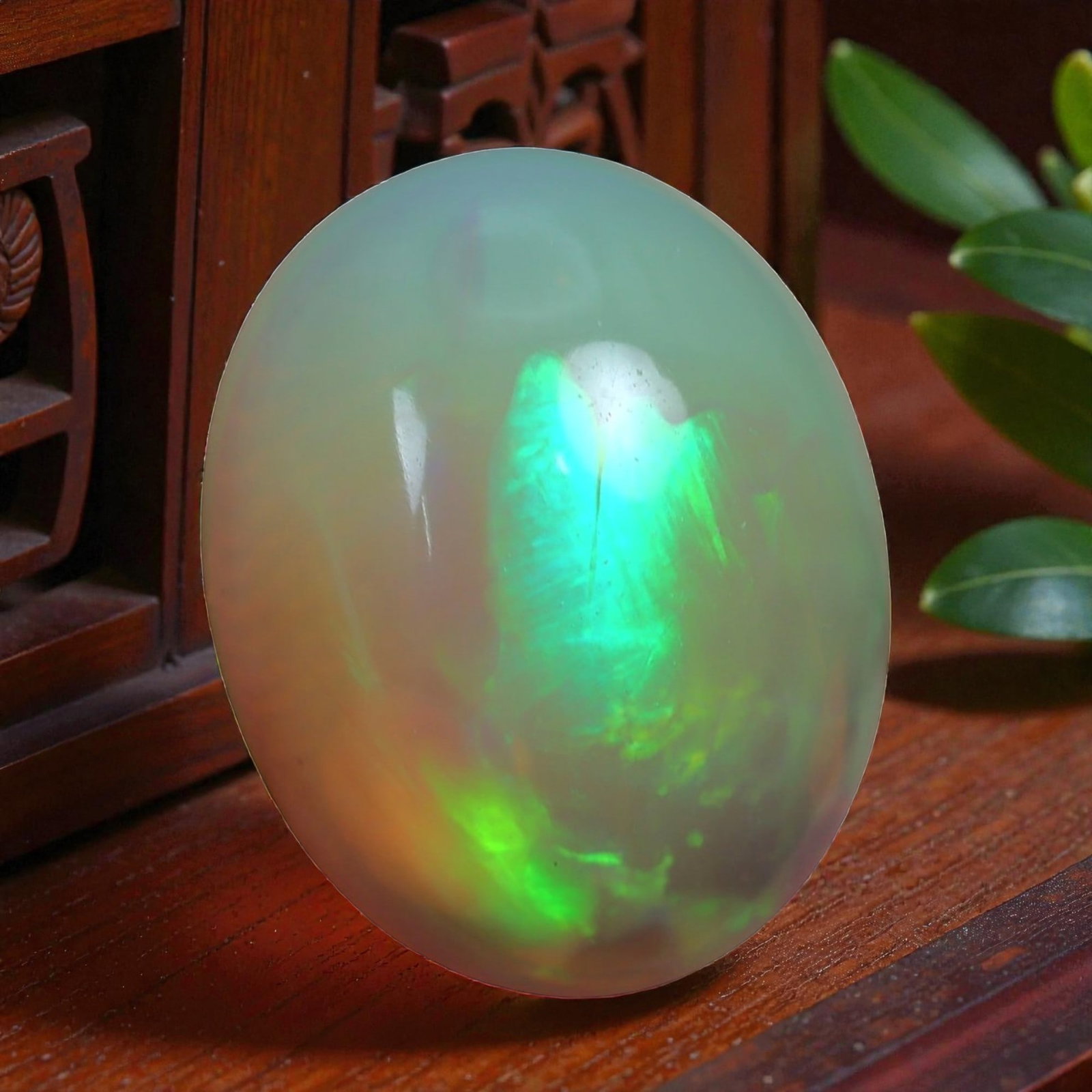 2.73 Carats Play-of-Color Welo Opal - Natural Ethiopian Gem 11x9mm, 20XC: This captivating Welo opal gleams with a luminous cascade of multi neon color that ripple across the stone's surface with every movement. The play-of-color is vivid and well-distributed, presenting a 