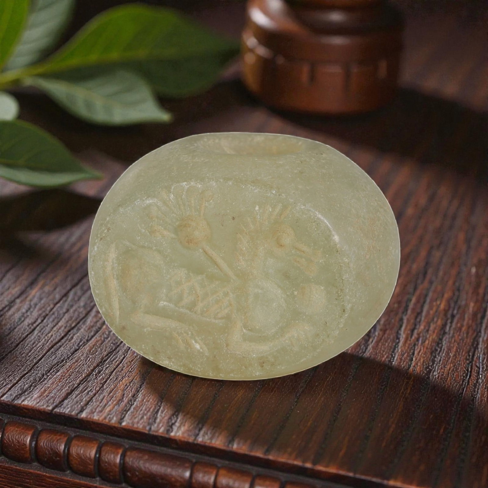 Ancient Sasanian Serpentine Zoomorphic Stamp Seal, 27AP: Crafted from pale green serpentine, this ancient Sasanian stamp seal features a deeply incised zoomorphic motif depicting a mythical creature in profile. The design includes a stylized quadruped with 