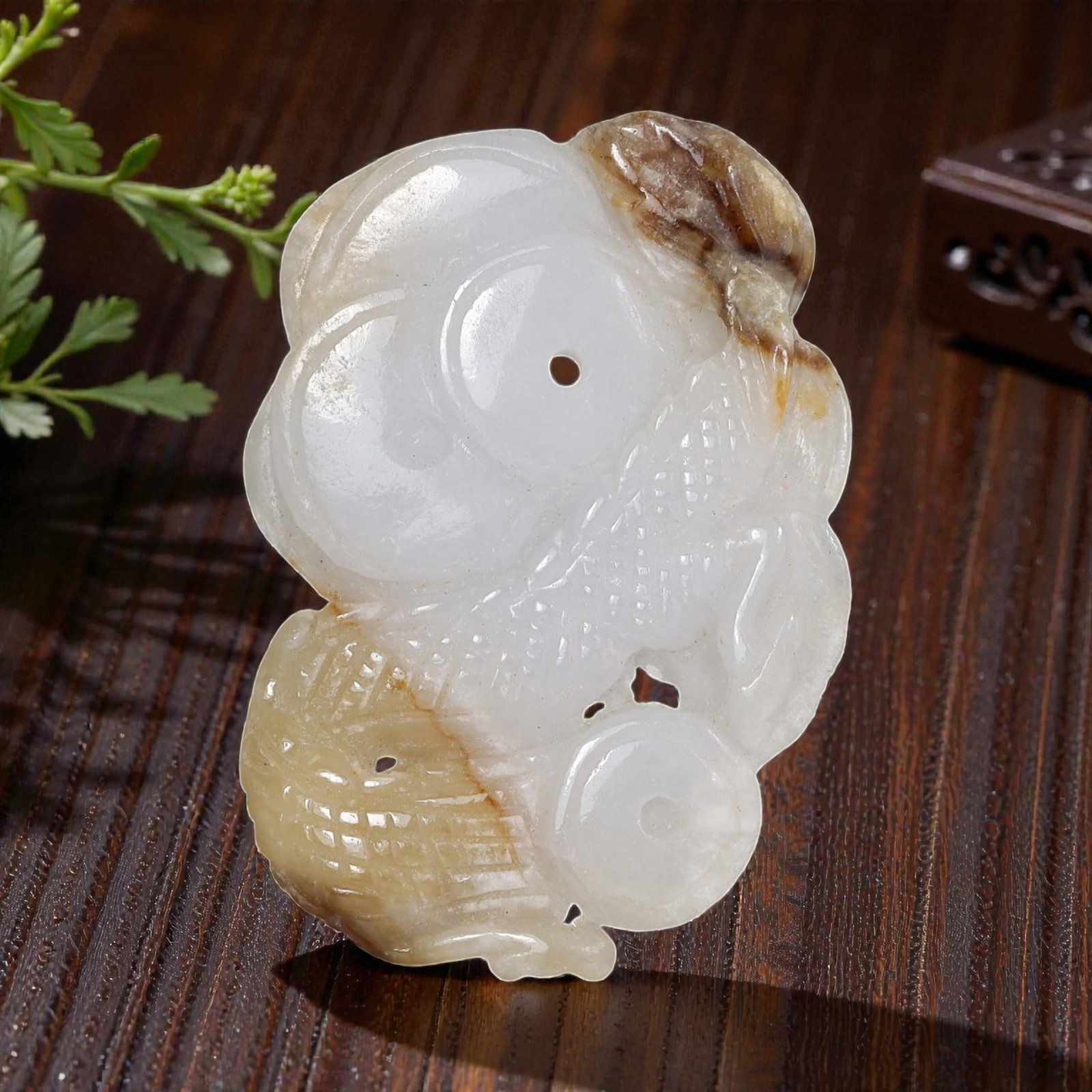 Vintage Burmese Jadeite Jade Carved Fish Pendant, 15AP: Crafted from natural Burmese jadeite, this vintage pendant features an intricately carved double-fish motif, a traditional symbol of abundance and harmony. The stone exhibits a soft white base with na