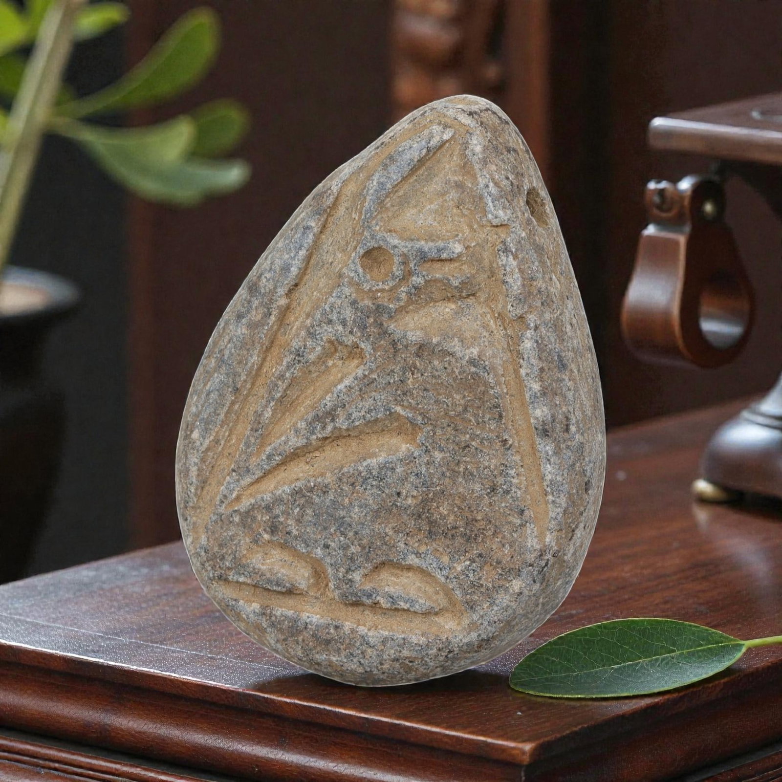 Antique Silk Road Schist Zoomorphic Amulet Pendant, 47YD: This ancient amulet pendant is carved from weathered grey schist, with a natural teardrop-shaped form and suspension hole at the top. The face features a deeply engraved zoomorphic motif depicting a s