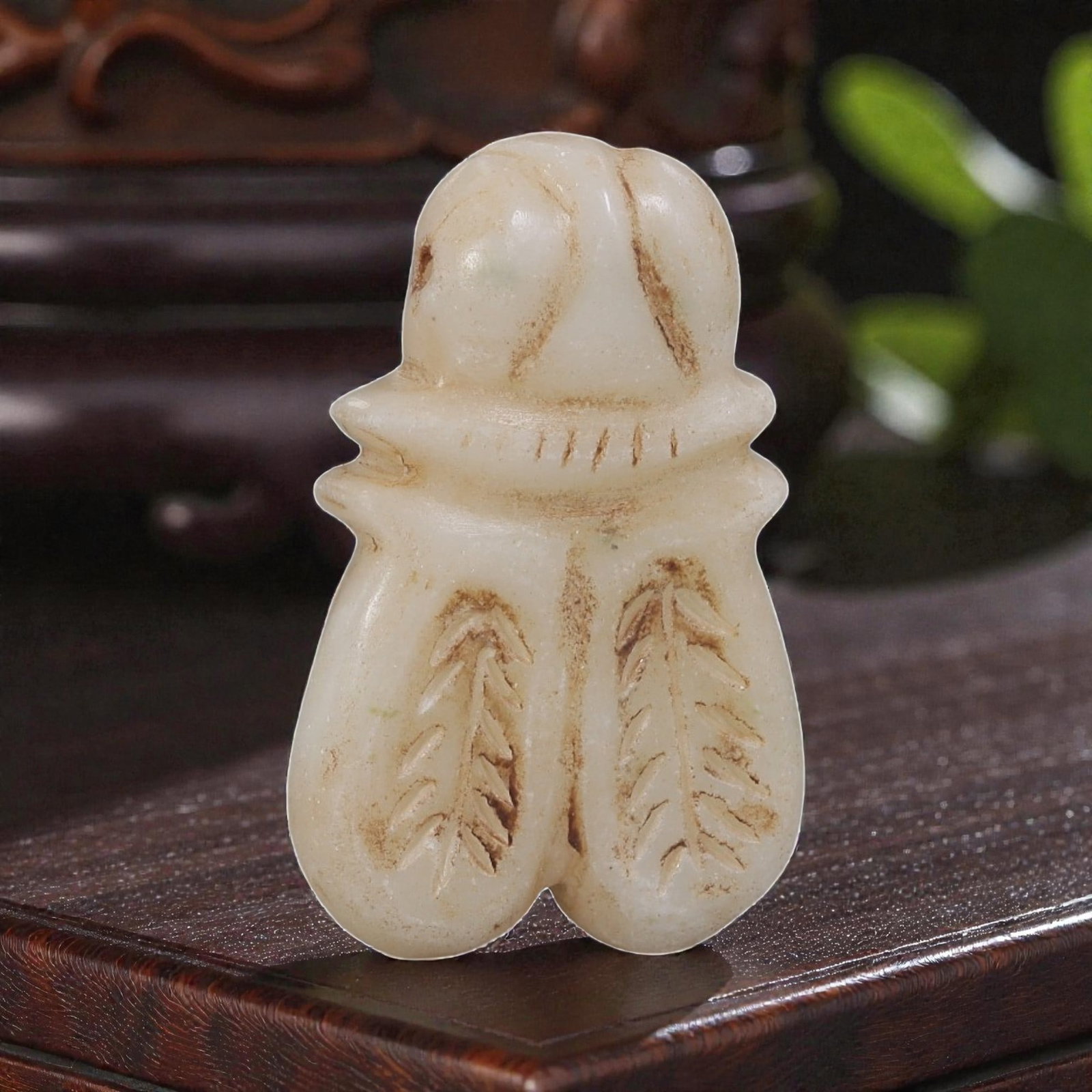 Ancient Bactrian Zoomorphic Marble Amulet, Circa 3rd-2nd Millennium BCE, 85YD: This ancient zoomorphic amulet is carved from pale, creamy marble, depicting a stylized insect form, likely a fly or scaraboid figure, with a rounded head, segmented collar, and symmetrical wing-like 