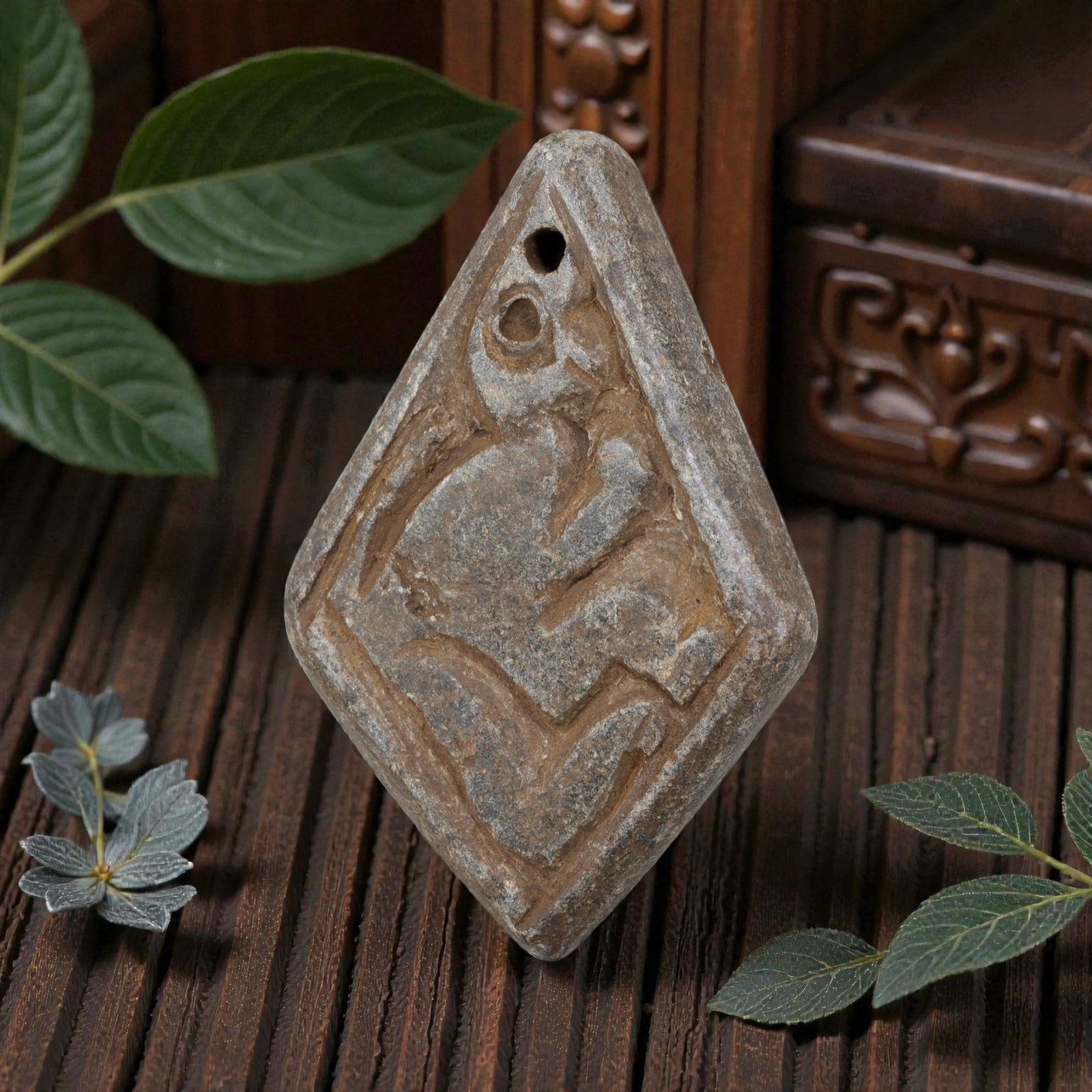 Antique Silk Road Schist Zoomorphic Amulet Pendant, 46YD: This ancient amulet pendant is carved from weathered grey schist, with a diamond-shaped form and suspension hole at the top. The face features a deeply engraved zoomorphic motif depicting a stylized q