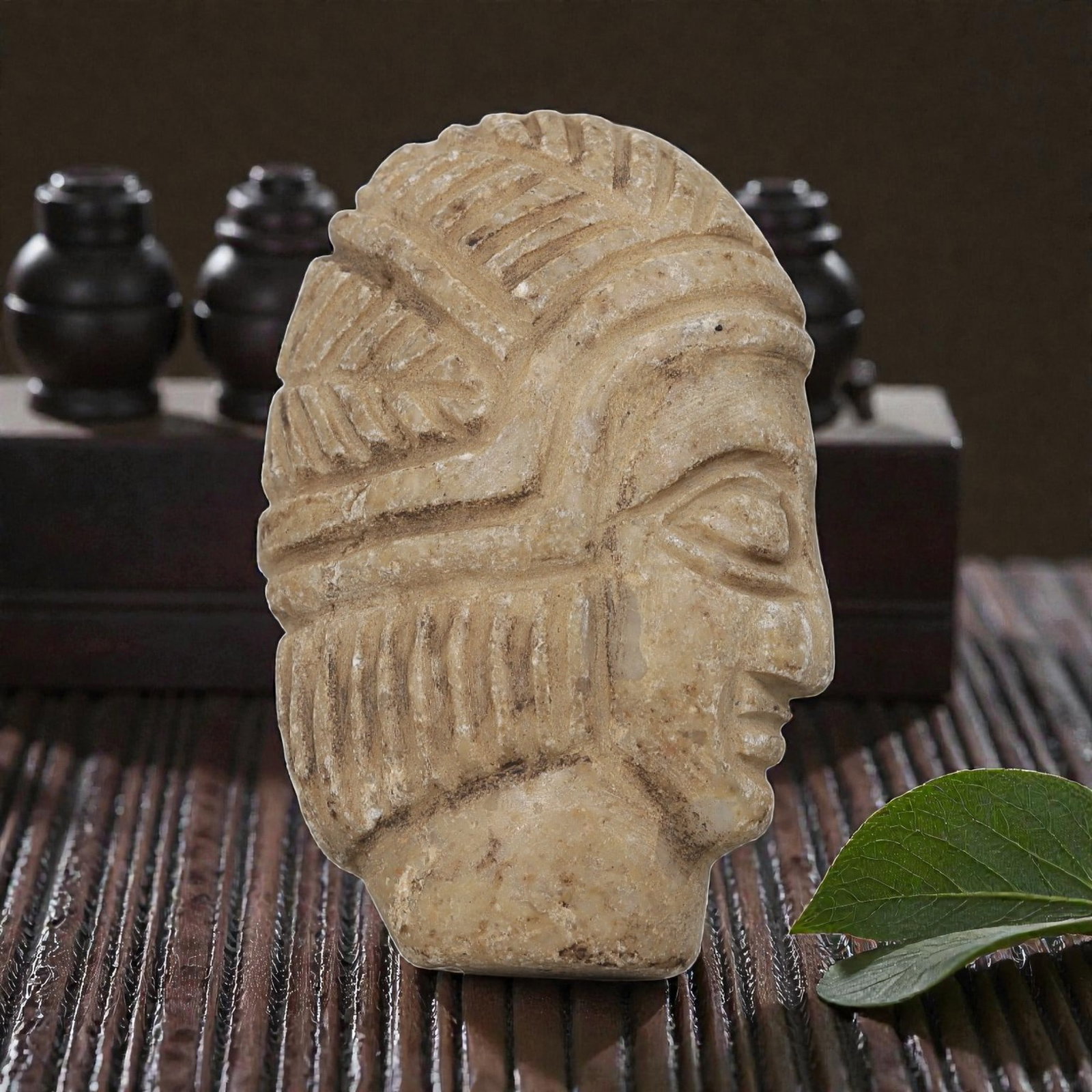 Antique Egyptian Steatite Intaglio with Profile Head Motif, 37AP: Carved from light beige steatite, this profile head features deeply incised linear patterns representing the layered headdress and hairstyle, alongside defined facial features including almond-shaped 