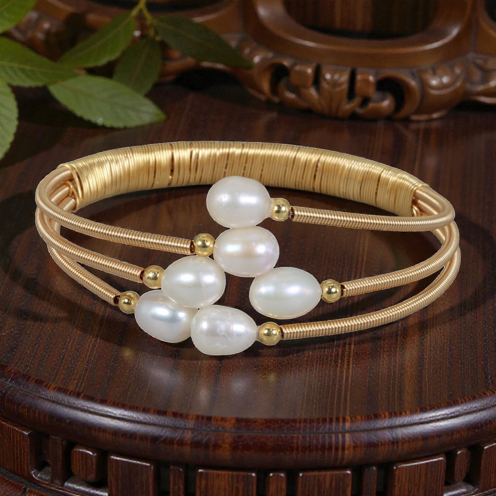 Natural Freshwater Pearl Gold Tone Triple-Wire Open Cuff Bracelet, 9EB: A delicate open cuff bracelet crafted with gold tone triple wire, featuring a lush arrangement of six natural white freshwater pearls interspersed with small gold tone spacer beads. The layered design