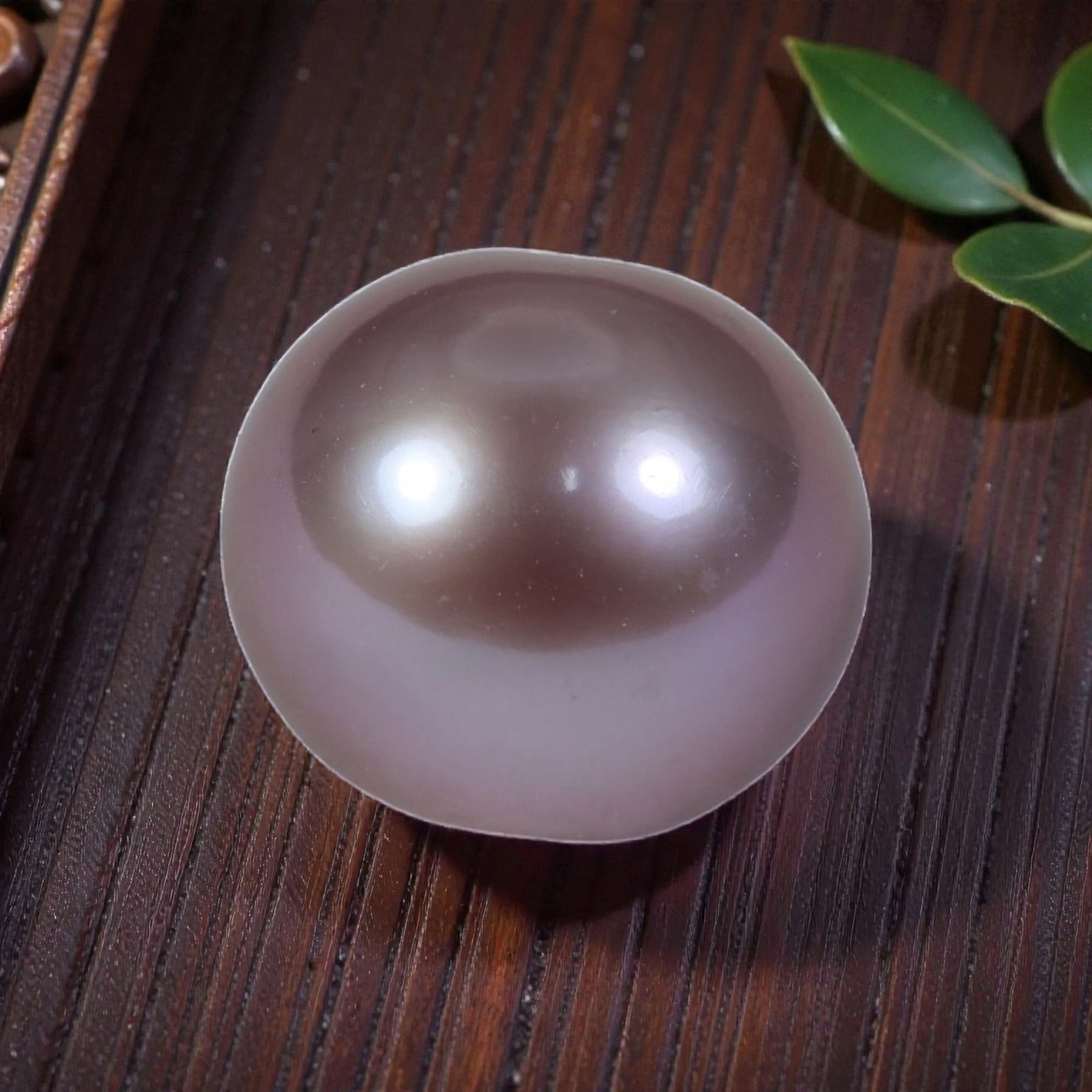 11.37ct Natural Fresh Water Pearl 11.6mm, 36YH: This is a natural freshwater pearl, showcasing a soft, ethereal pinkish-lavender hue with a smooth, polished surface and a bright, mirror-like luster. The pearl features a perfectly round shape with e