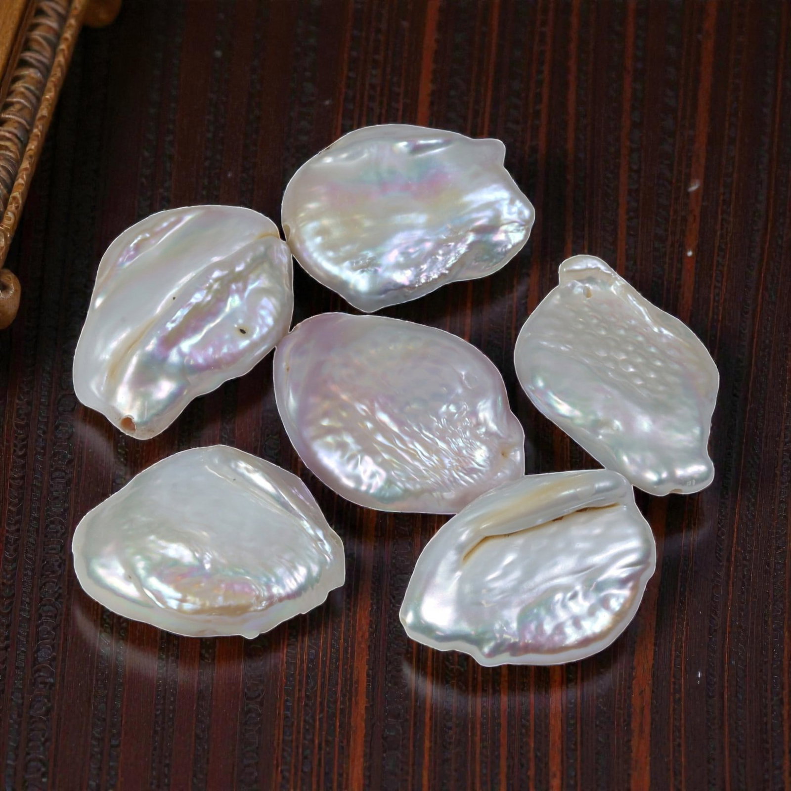71.50ct Natural Fresh Water Keshi Pearl Drilled, 38YH: This is a drilled, natural freshwater Keshi pearl, showcasing an ethereal, multi-colored iridescent luster across its organic baroque form. The surface displays the natural texture of the nacre, with 