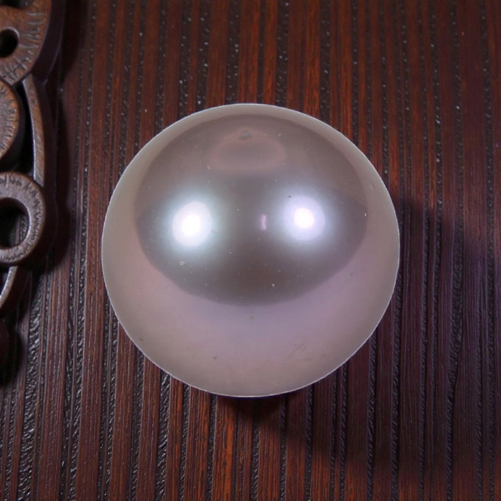 10.63ct Natural Fresh Water Pearl 11.5mm, 37YH: This is a natural freshwater pearl, showcasing a soft, ethereal pinkish-lavender hue with a smooth, polished surface and a bright, mirror-like luster. The pearl features a perfectly round shape with e